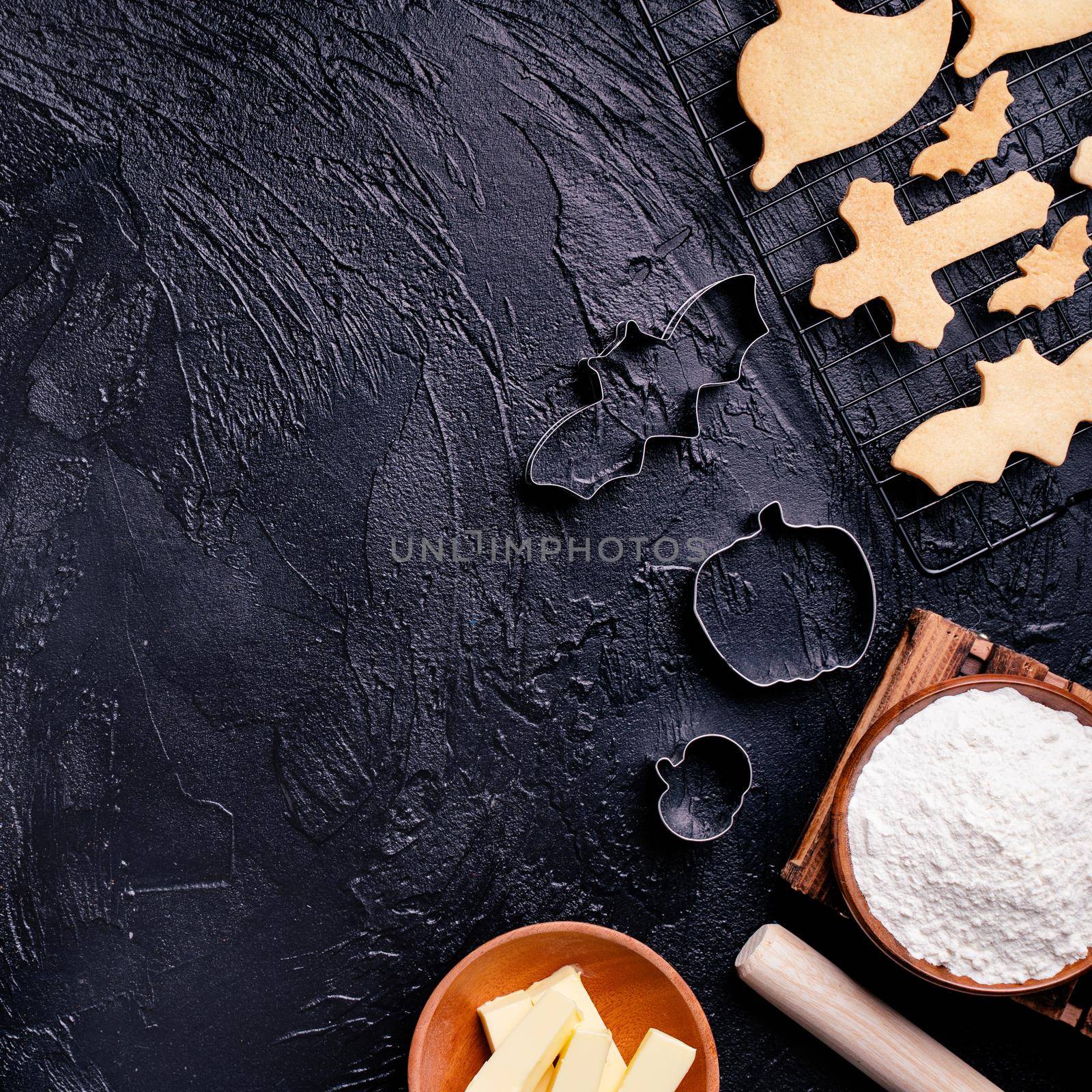 Design concept of making Halloween cookies, baking recipe ingredients layout of preparing party, top view, flat lay, overhead, blank copy space.