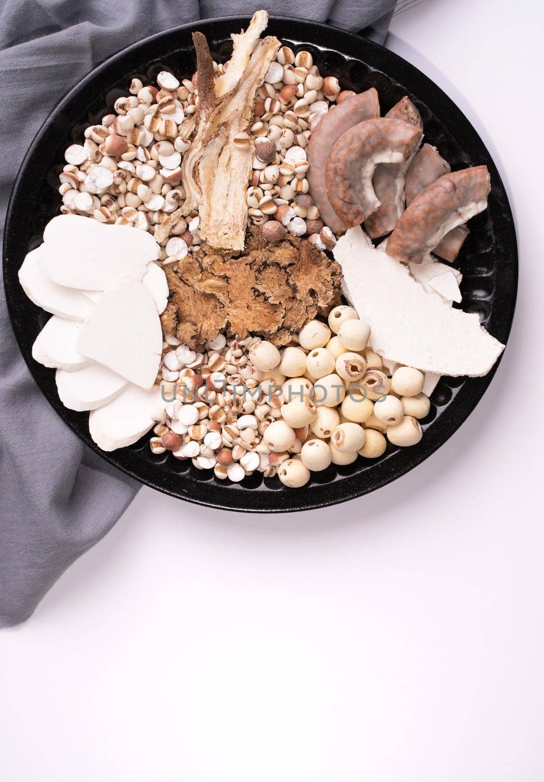 Ingredients of Four Tonics Soup, Four Herb Flavor Soup. Taiwanese traditional food with Job's tears, herbs, pork intestines on white background