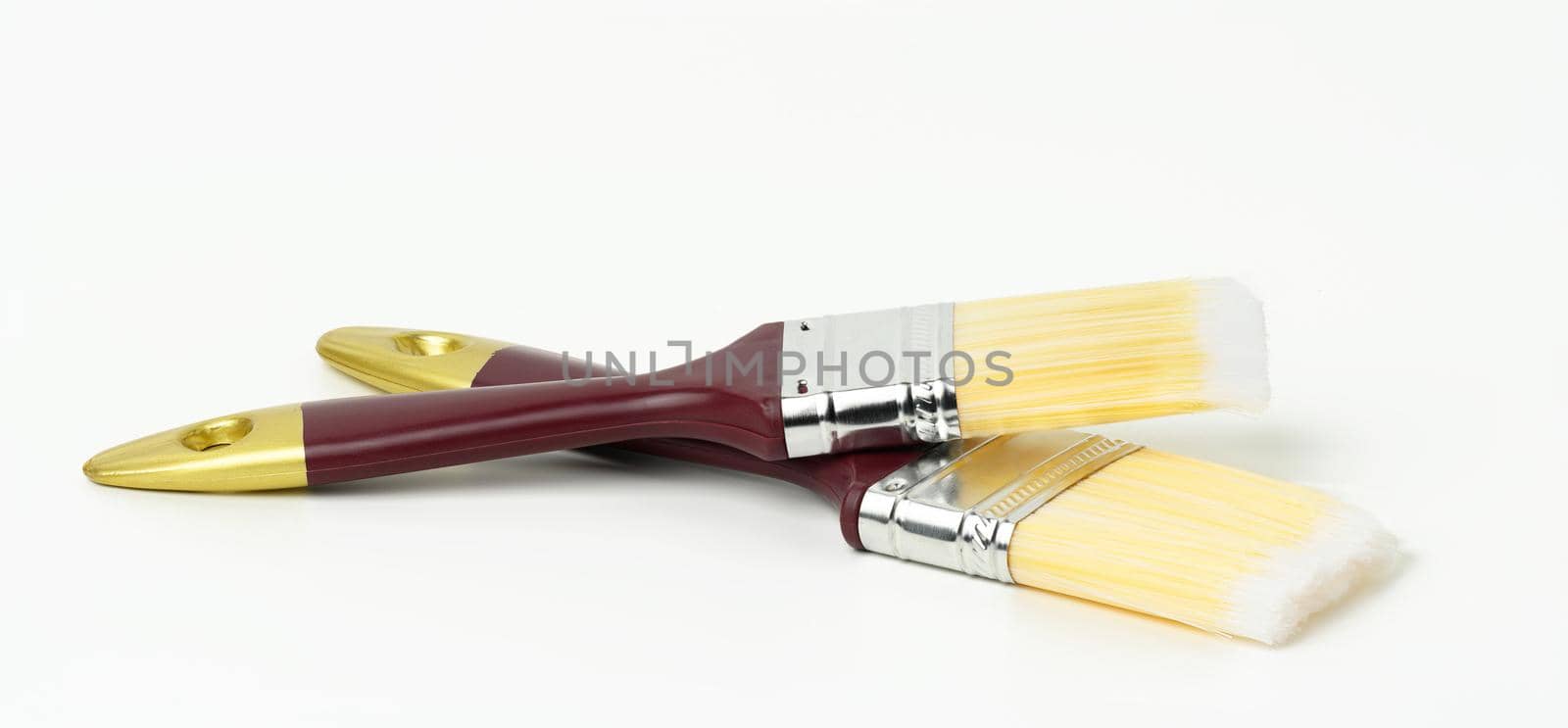 soft paint brush on wooden handle on white background by ndanko