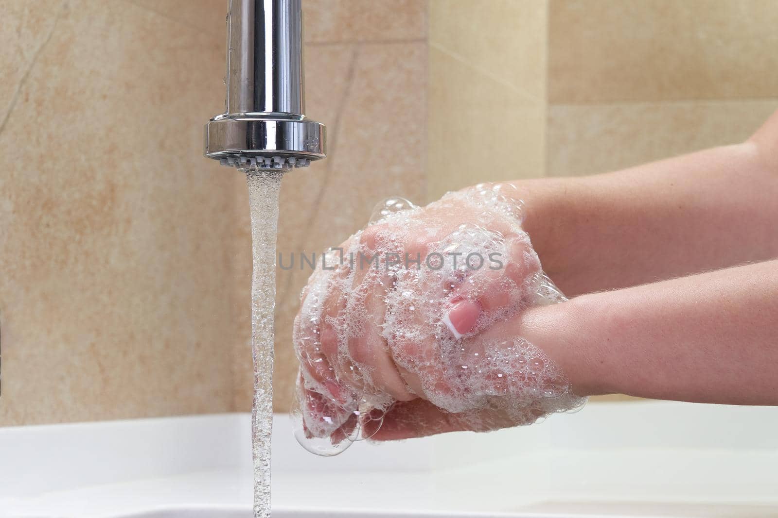 Woman washing hands with antibacterial soap for corona virus prevention, hygiene to stop spreading coronavirus covid19