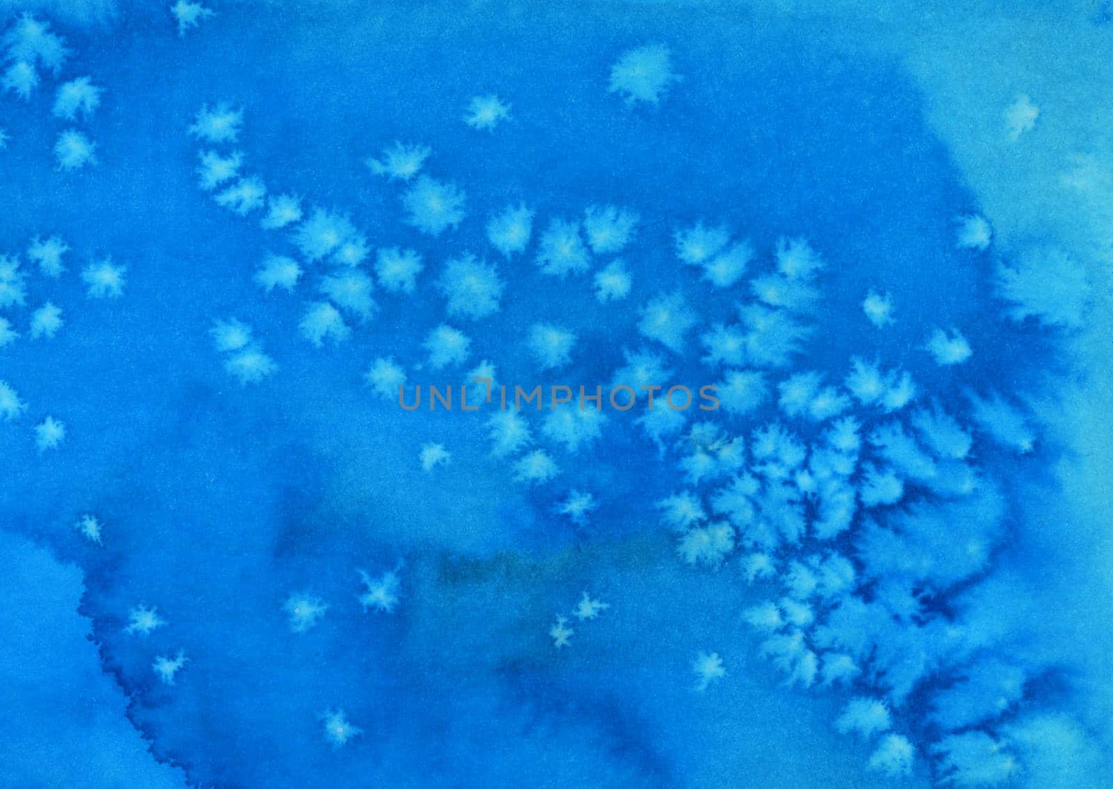 Abstract blue background texture. Made with water ink and salt. Watery image