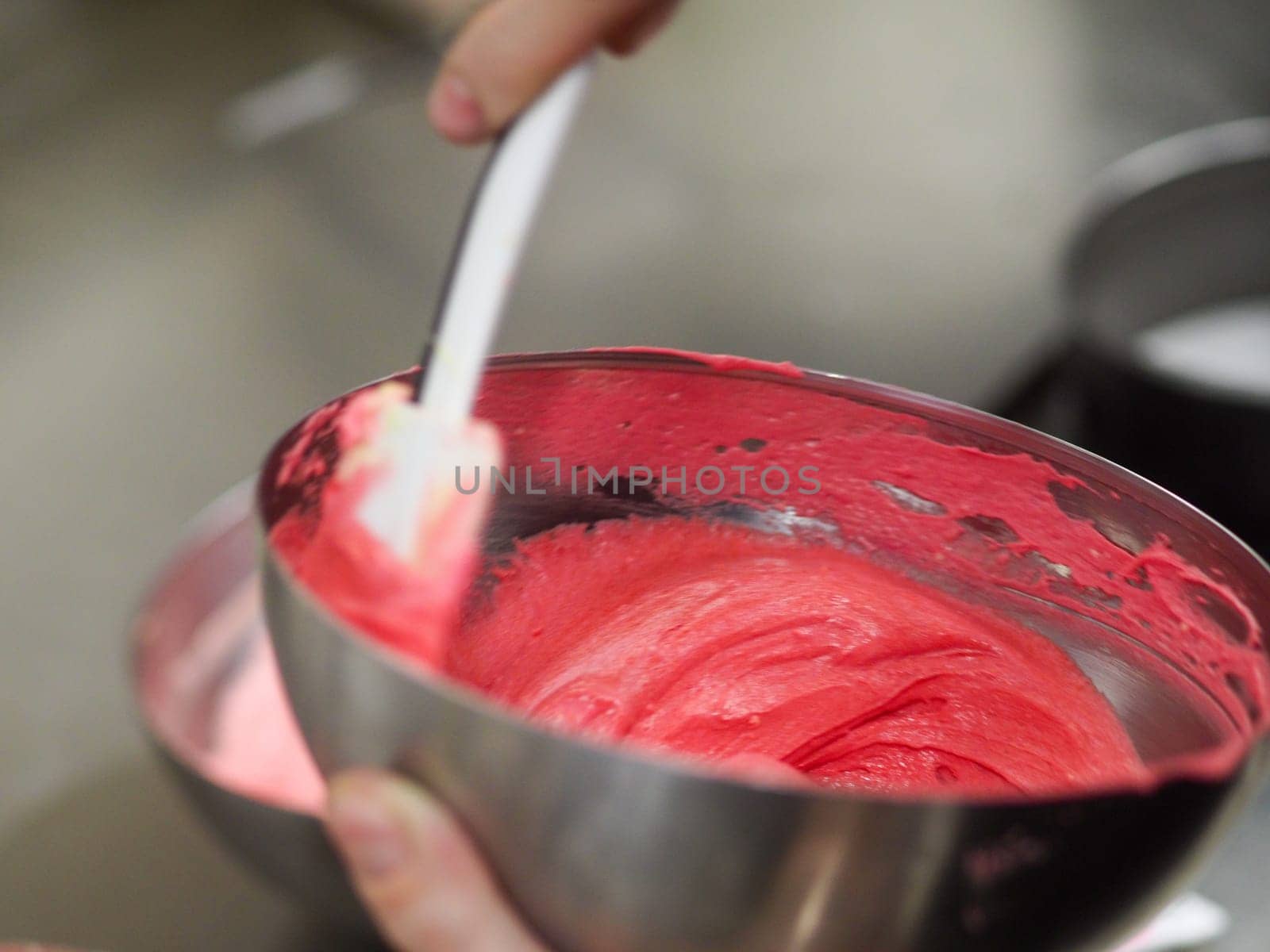 chef preparing white pink red cake creamy mixtures doughs to bake in the oven