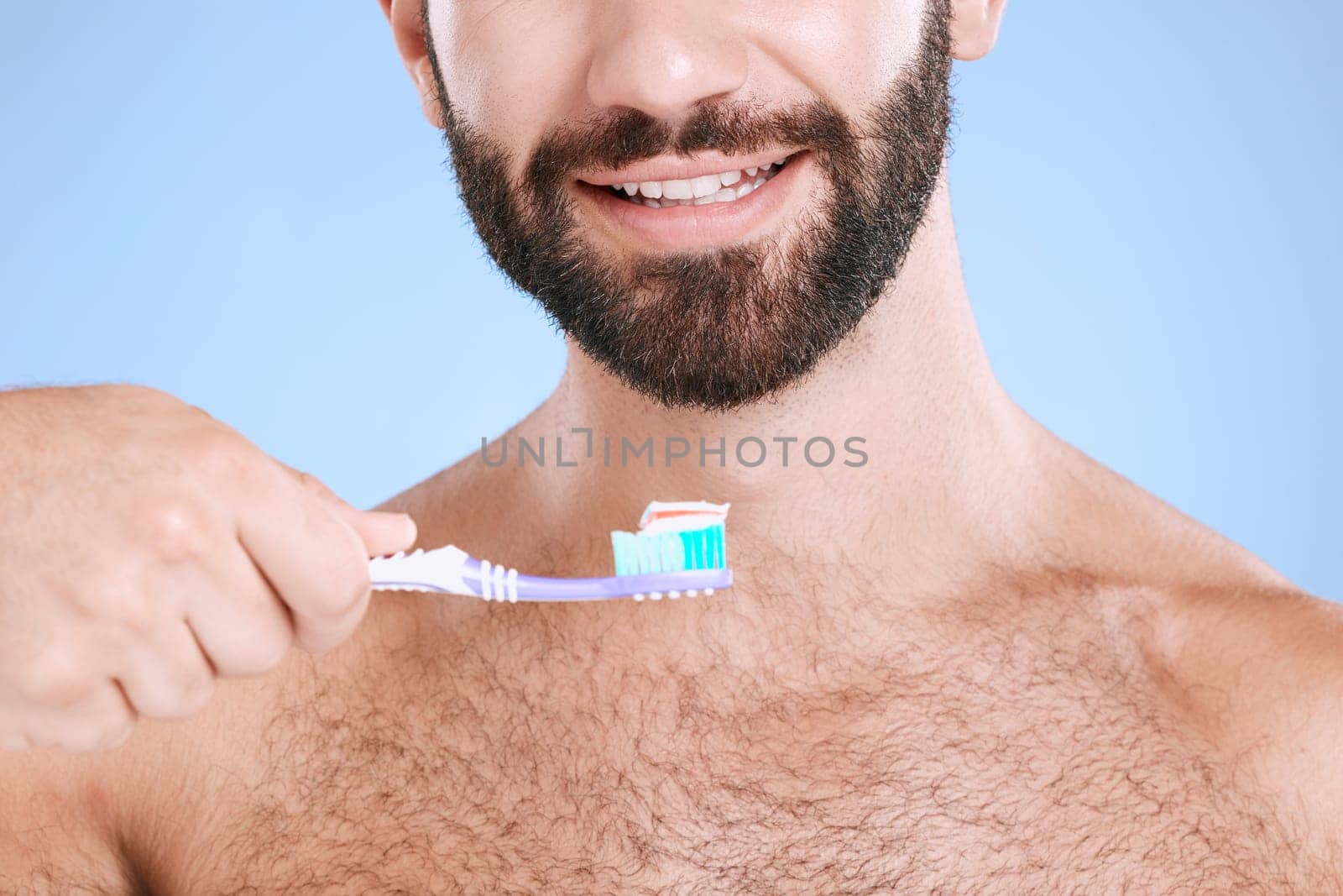 Brushing teeth, studio face and man with toothbrush, dental wellness and healthy mouth care. Happy male model, oral cleaning and smile for fresh breath, facial happiness and toothpaste for cosmetics by YuriArcurs