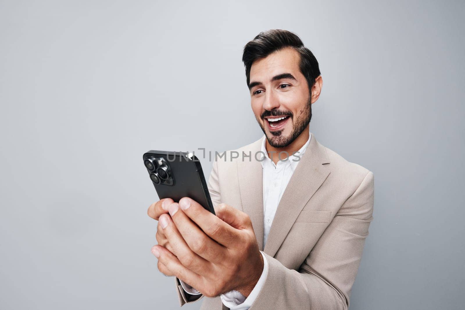 man connection happy gray smile call beard hold holding portrait phone app smartphone white suit phone guy mobile young businessman business background