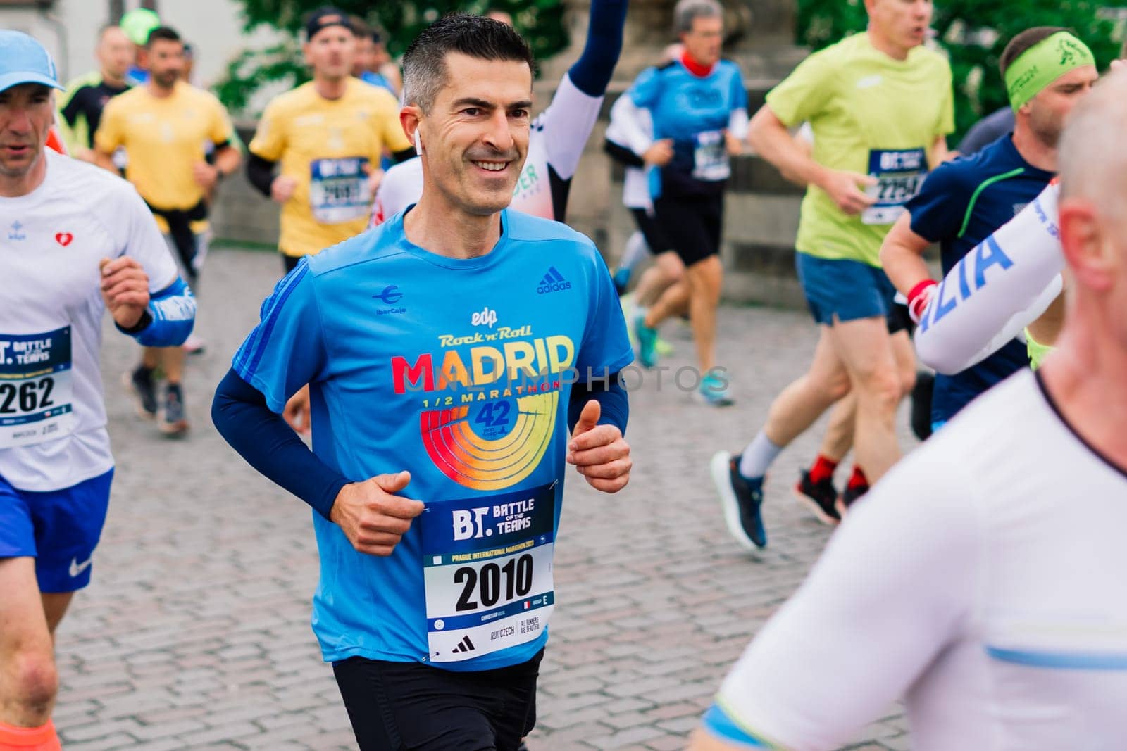 Prague, Czechia - 7th May 2023 - Group athletes runners run marathon in a sunlight