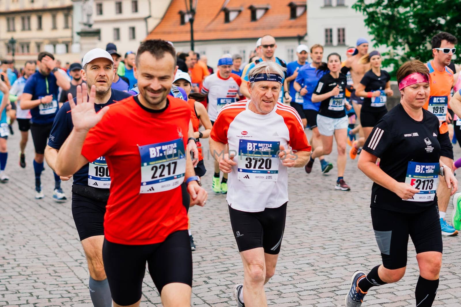 Prague, Czechia - 7th May 2023 - Group athletes runners run marathon in a sunlight