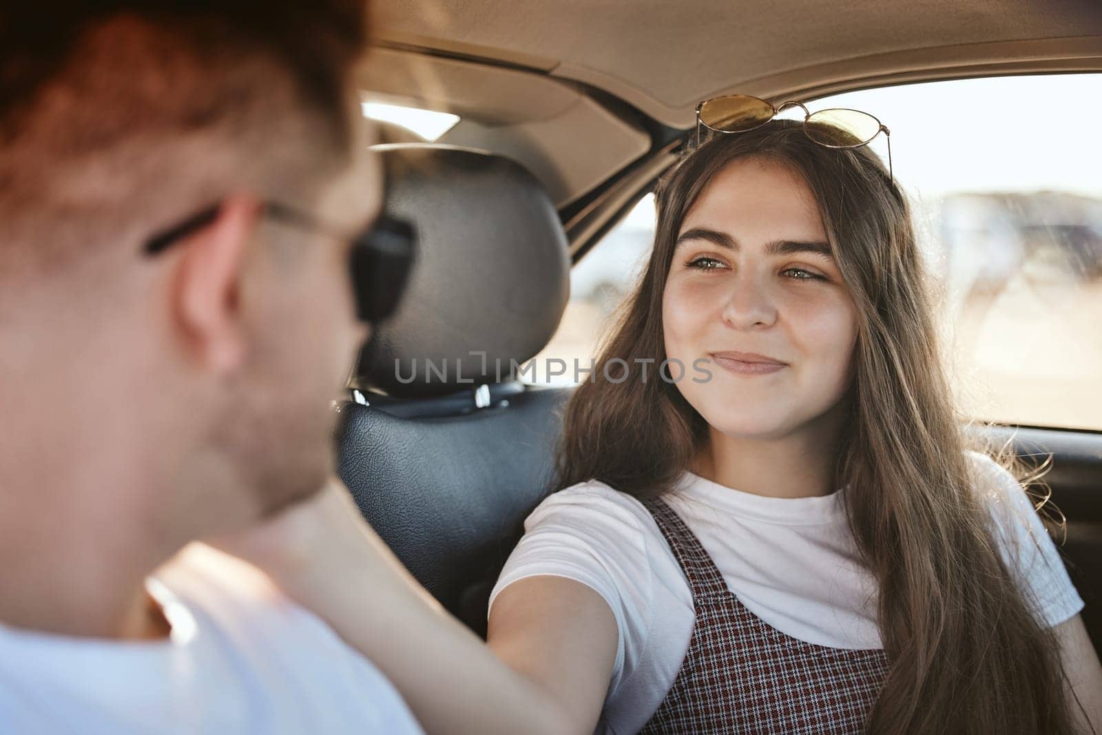 Love, care and couple on car road trip for fun travel adventure, bonding and enjoy romantic quality time together. Peace, wellness and freedom for young gen z man and woman in motor transportation.