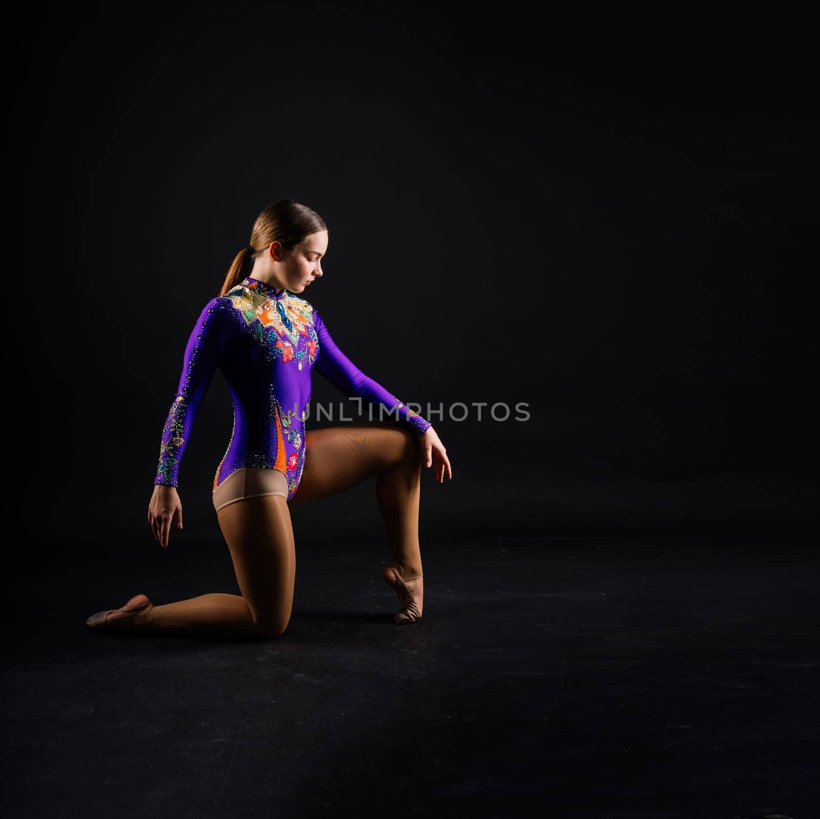 Beautiful cool young fit gymnast woman in sportswear dress working out, performing art gymnastics by Zelenin