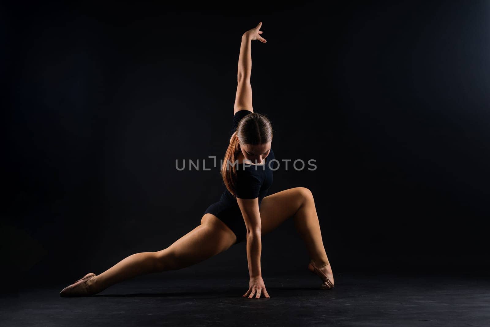 Beautiful cool young fit gymnast woman in sportswear dress working out, performing art gymnastics by Zelenin