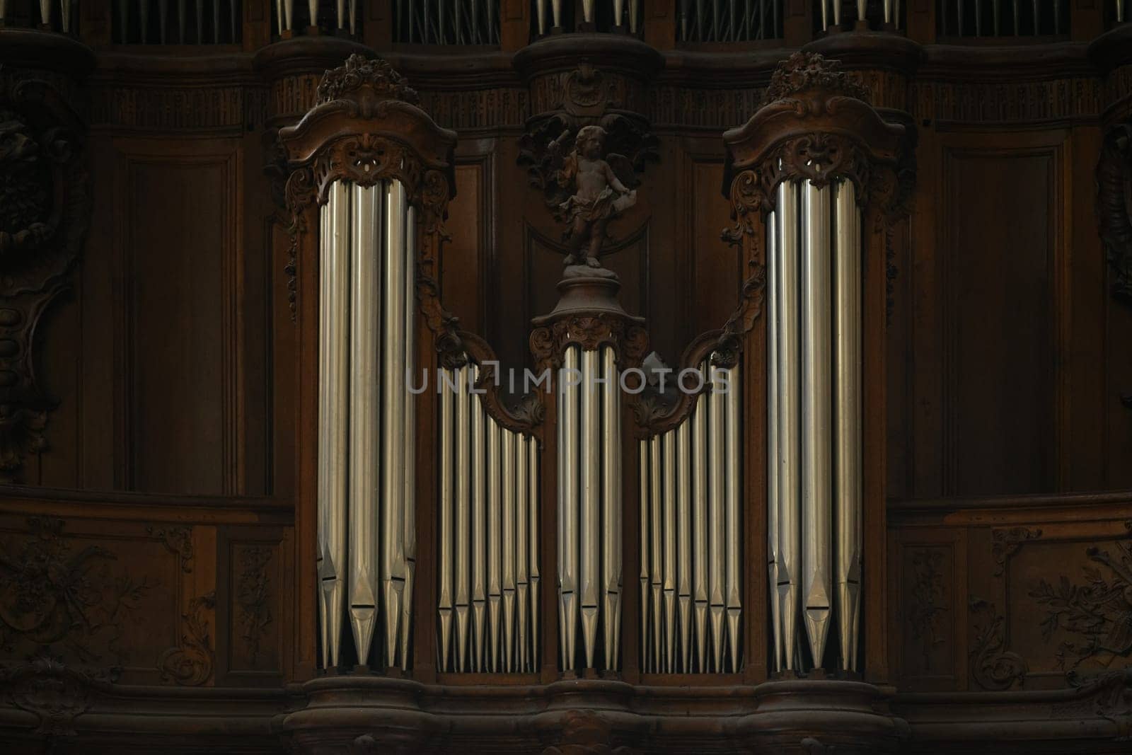 The organ in the church and the carved old wooden around