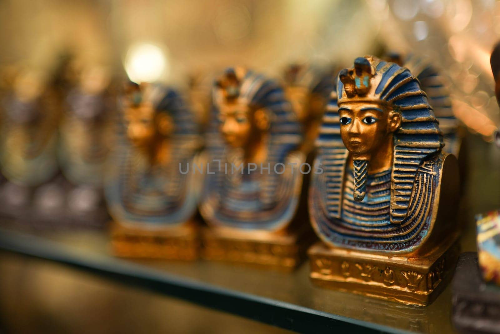 Small souvenir Pharaoh toy on the shelf. High quality photo