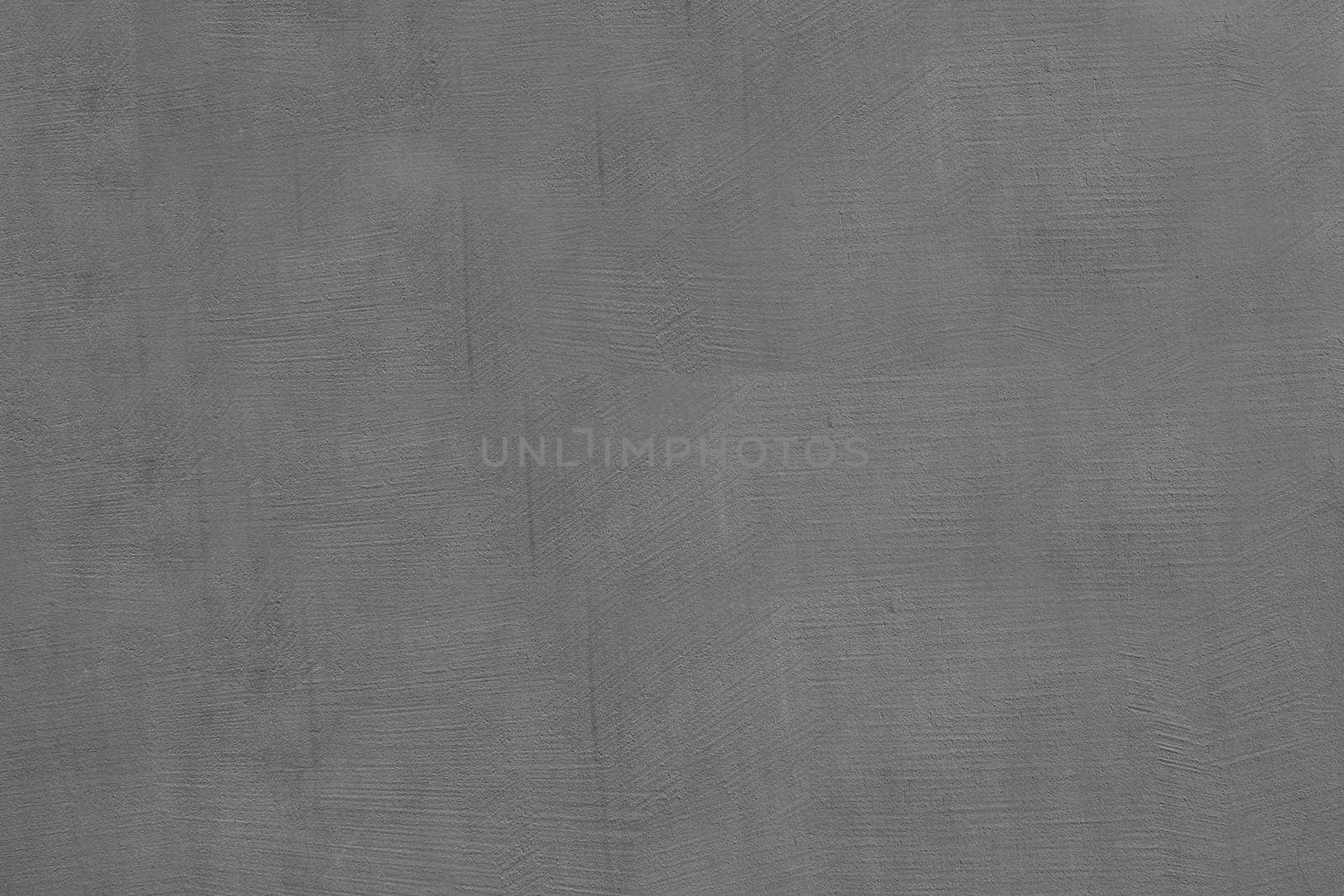 Dark grey cement wall background in vintage style for graphic design or wallpaper.