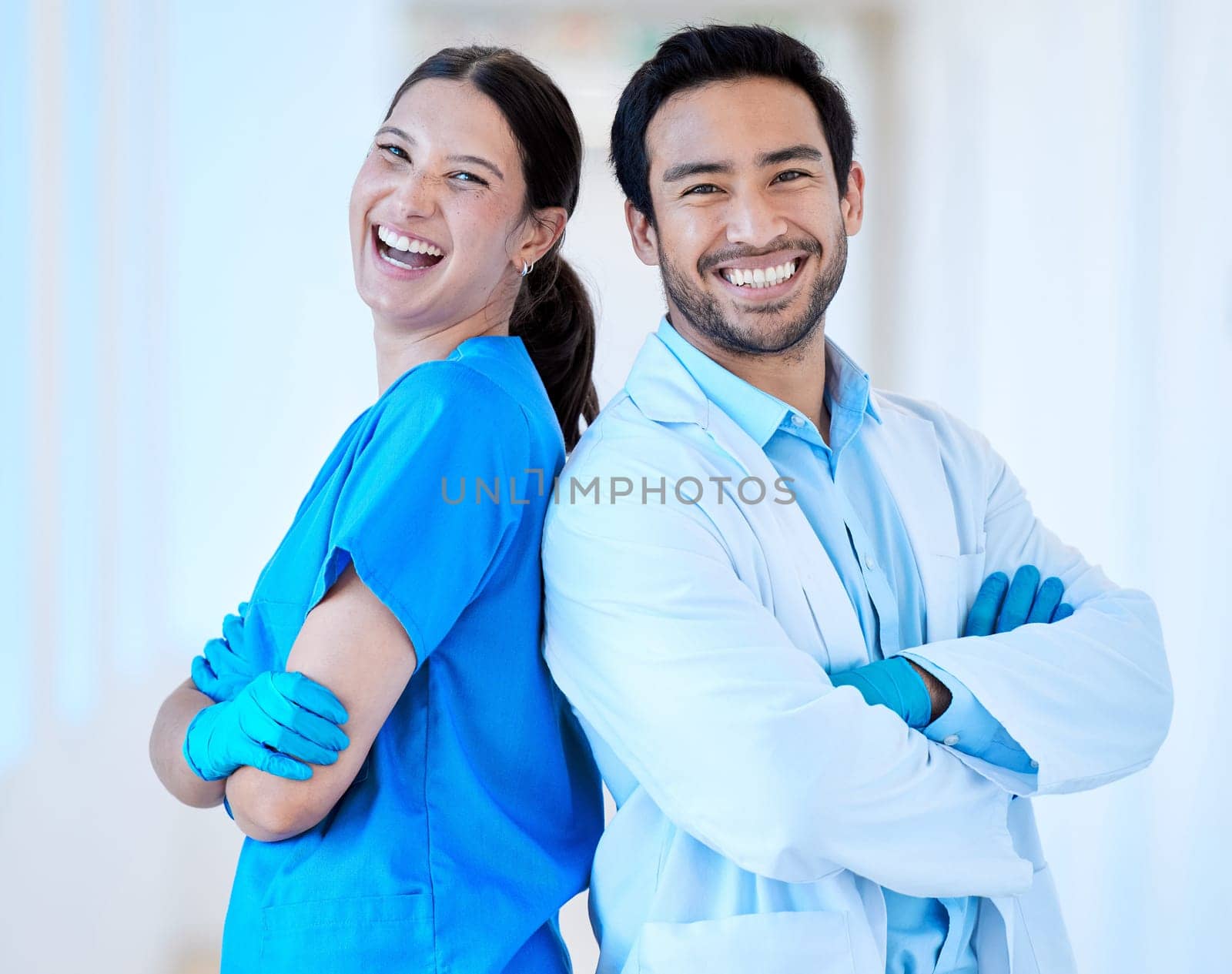 Dentist, laugh portrait and arms crossed with assistant and funny joke at dental office and clinic. Comedy, woman and healthcare professional with happiness and laughing in workplace with smile by YuriArcurs