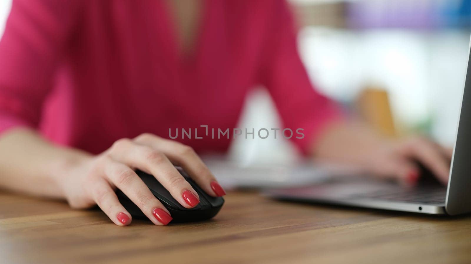 Hand of businesswoman working at computer using mouse closeup. Work online concept