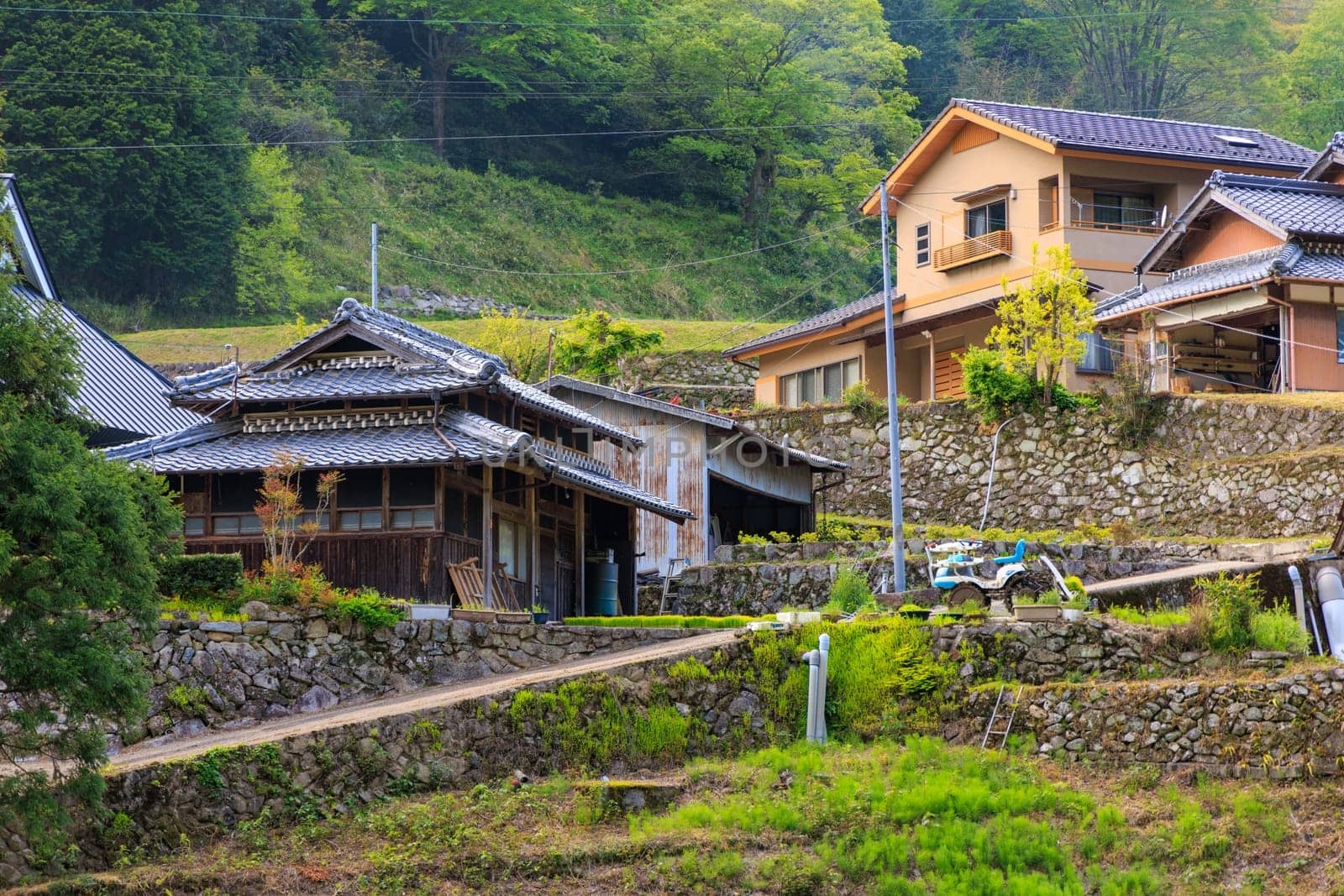 Traditional Japanese houses in historic hillside farming village by Osaze