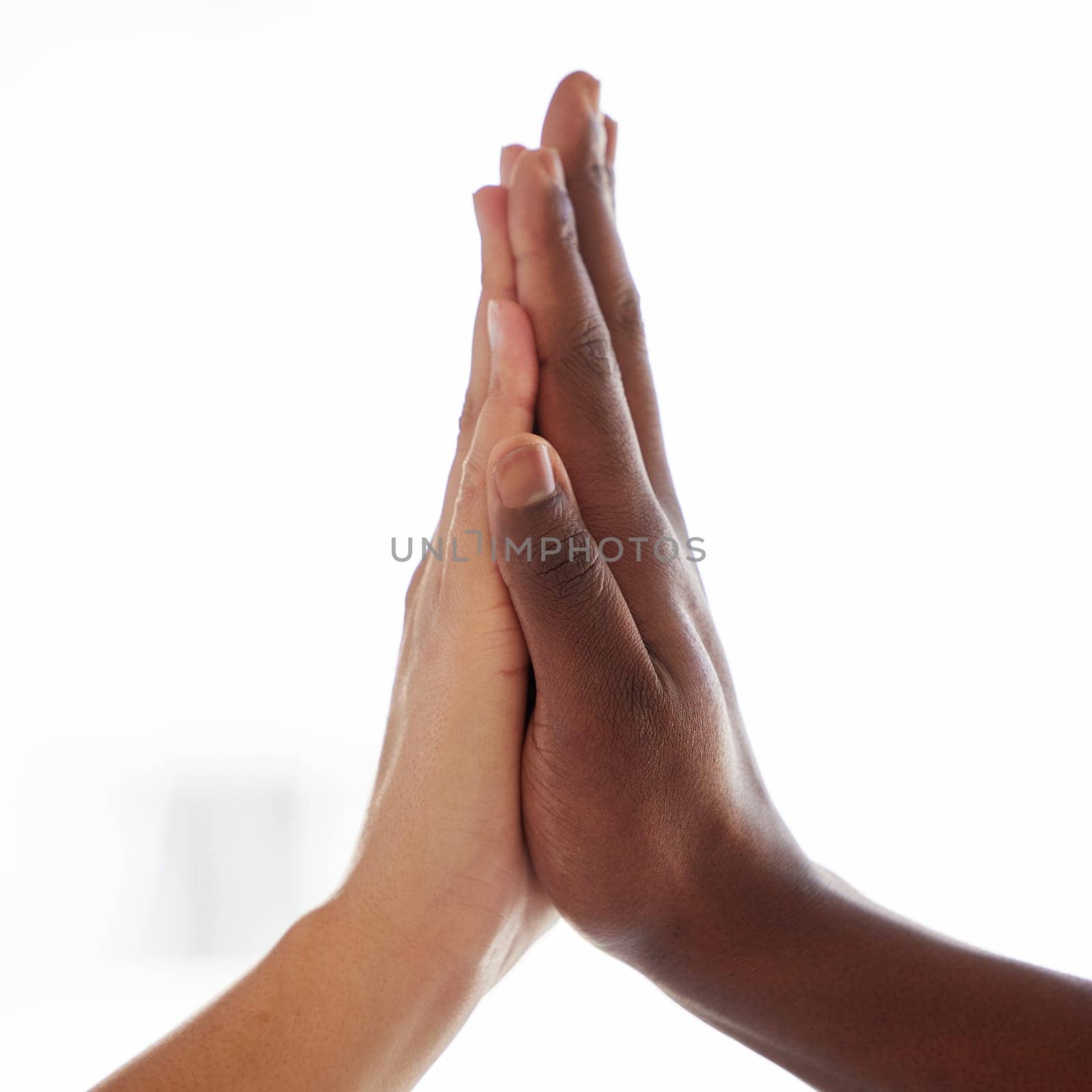 High five, diversity and hands of people in support of power, solidarity and collaboration on white background. Hands, connection and person friends in partnership, trust or team building success by YuriArcurs