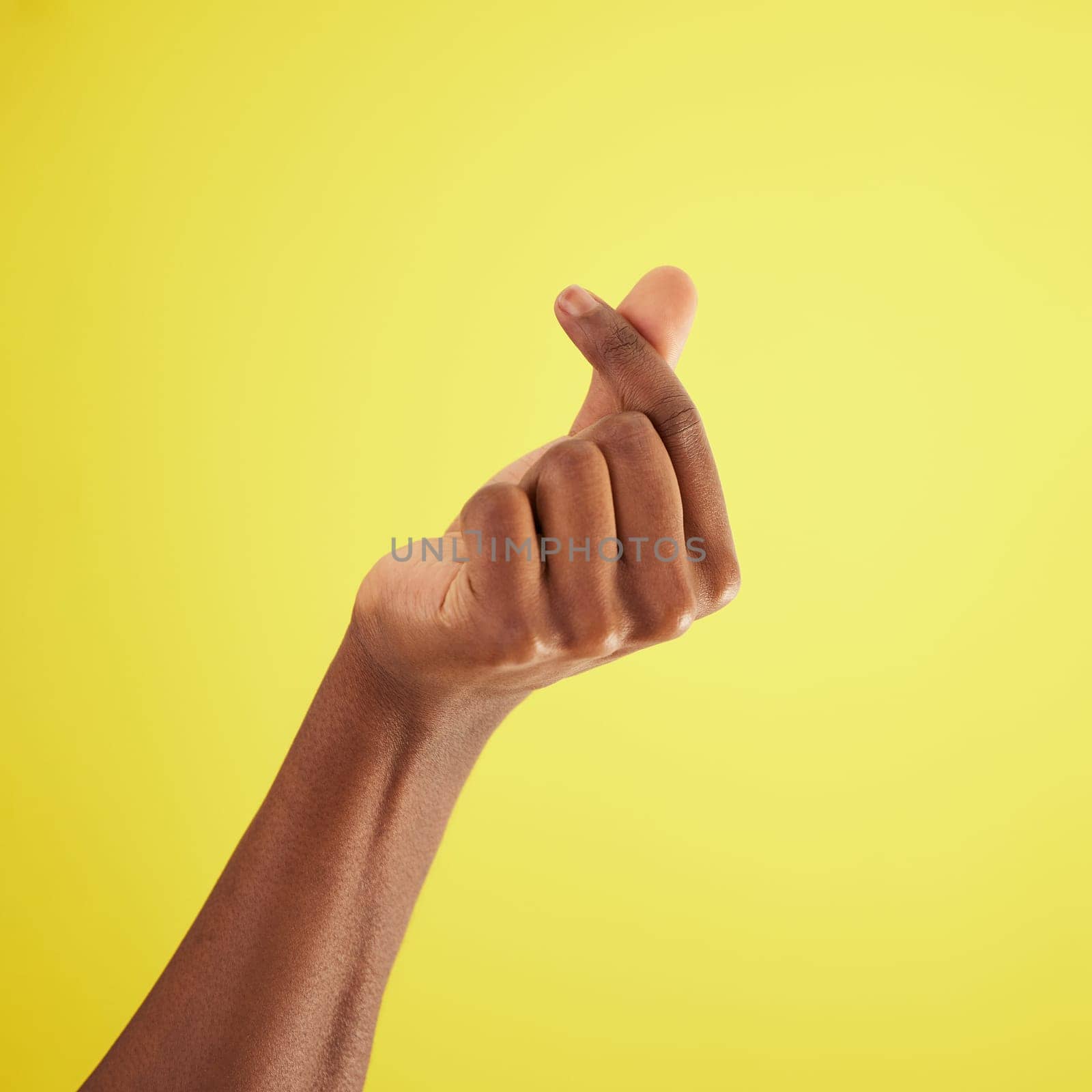 Hand, gesture for money and sign language of man closeup on studio background for cash, finance or currency. Person, thumb and index fingers rubbing together or symbol to pay, payment and poor by YuriArcurs