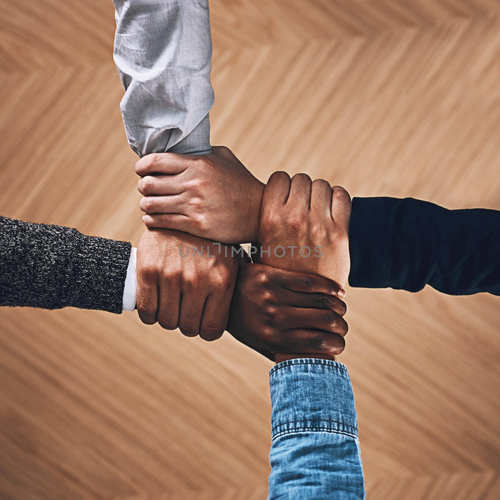 Collaboration, link or hands of business people with diversity for community support or teamwork in office. Zoom, above or group of employees with joint mission, trust or hope for goals together.