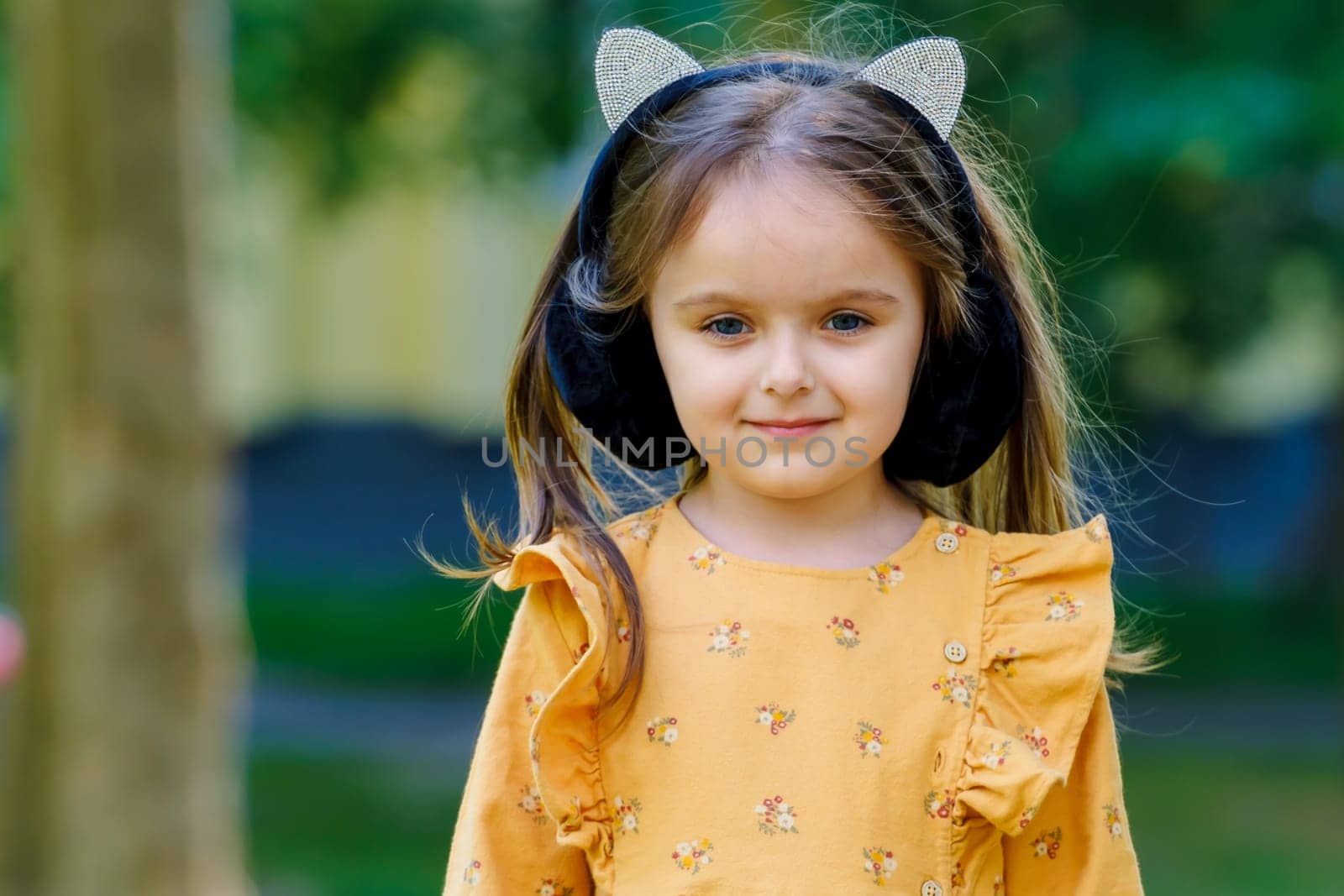 Portrait of a cute little girl in the park.