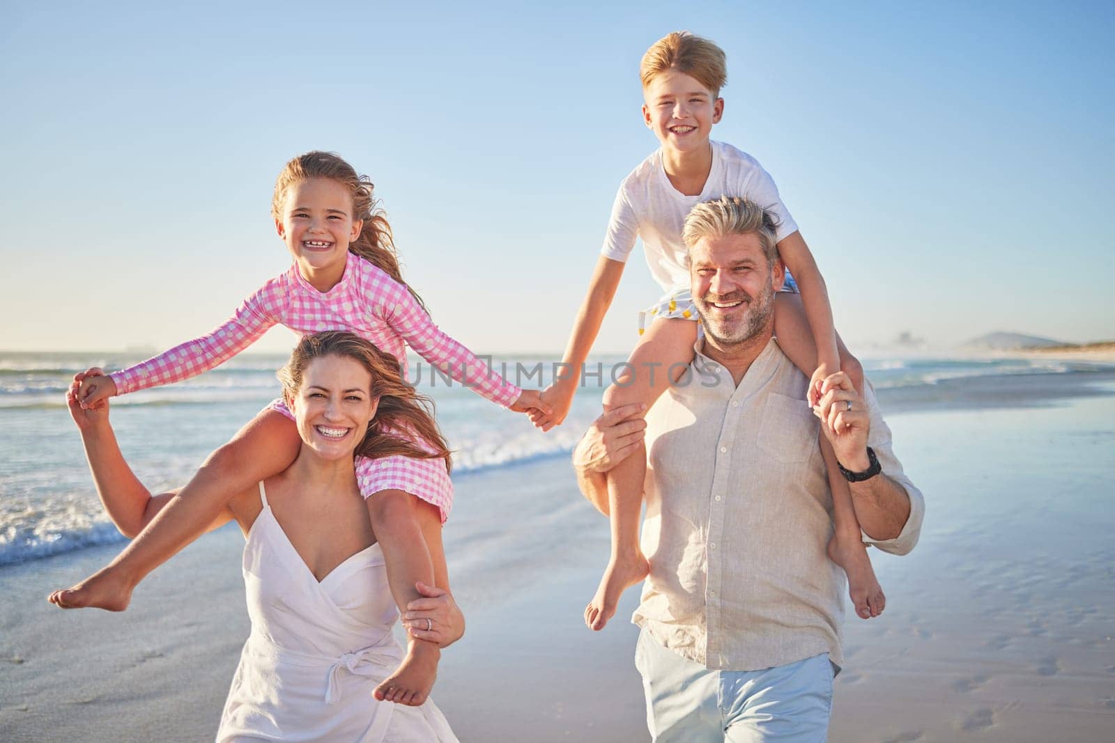 Happy family walking on beach for outdoor wellness, holiday in summer sunshine with care, love and support on blue sky mock up, Healthy parents and children bonding in portrait for youth fun near sea by YuriArcurs