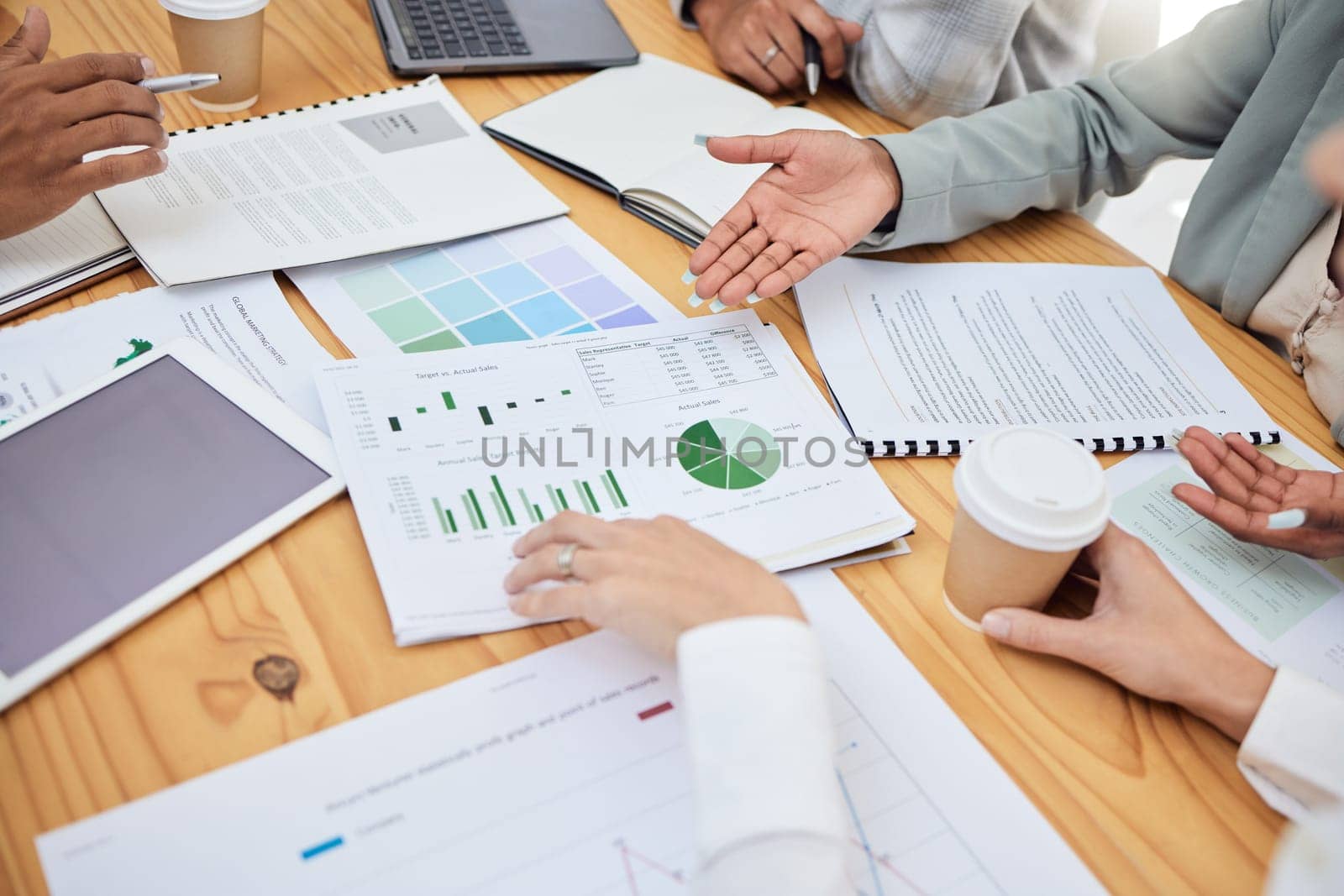 Documents, paper and chart for meeting, team and planning for finance, budget or market in office. Graph, corporate and strategy with research, group or collaboration for business, stock or teamwork.