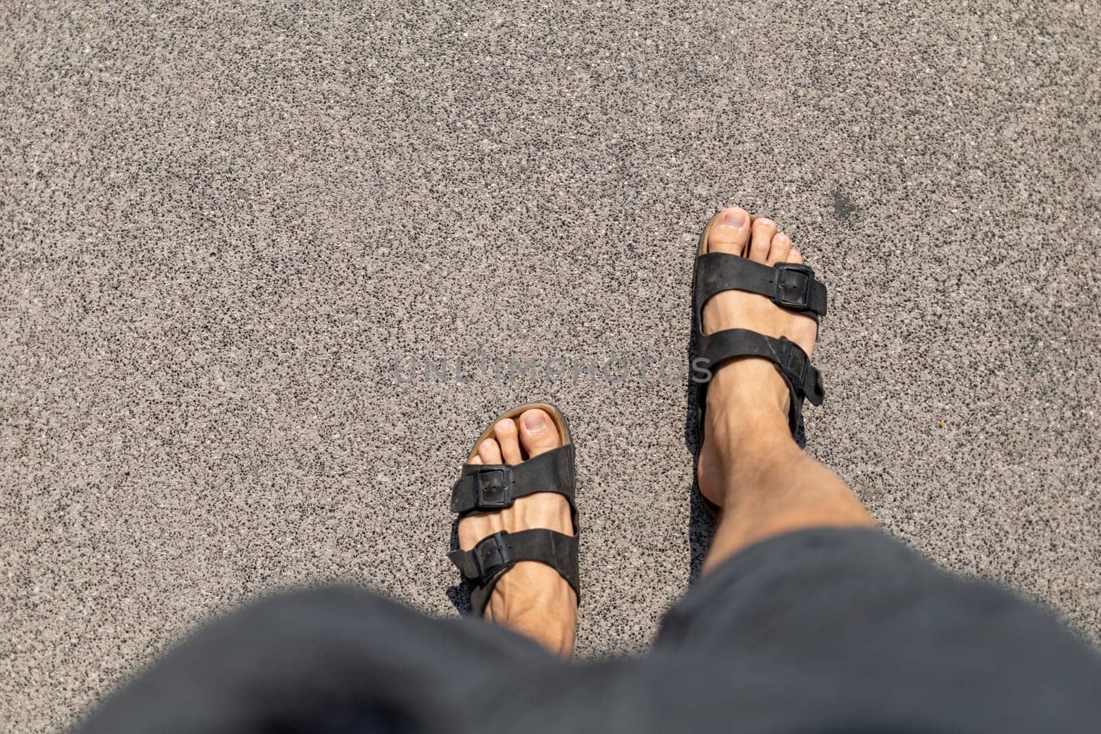 Male feet in slippers view from above. High quality photo