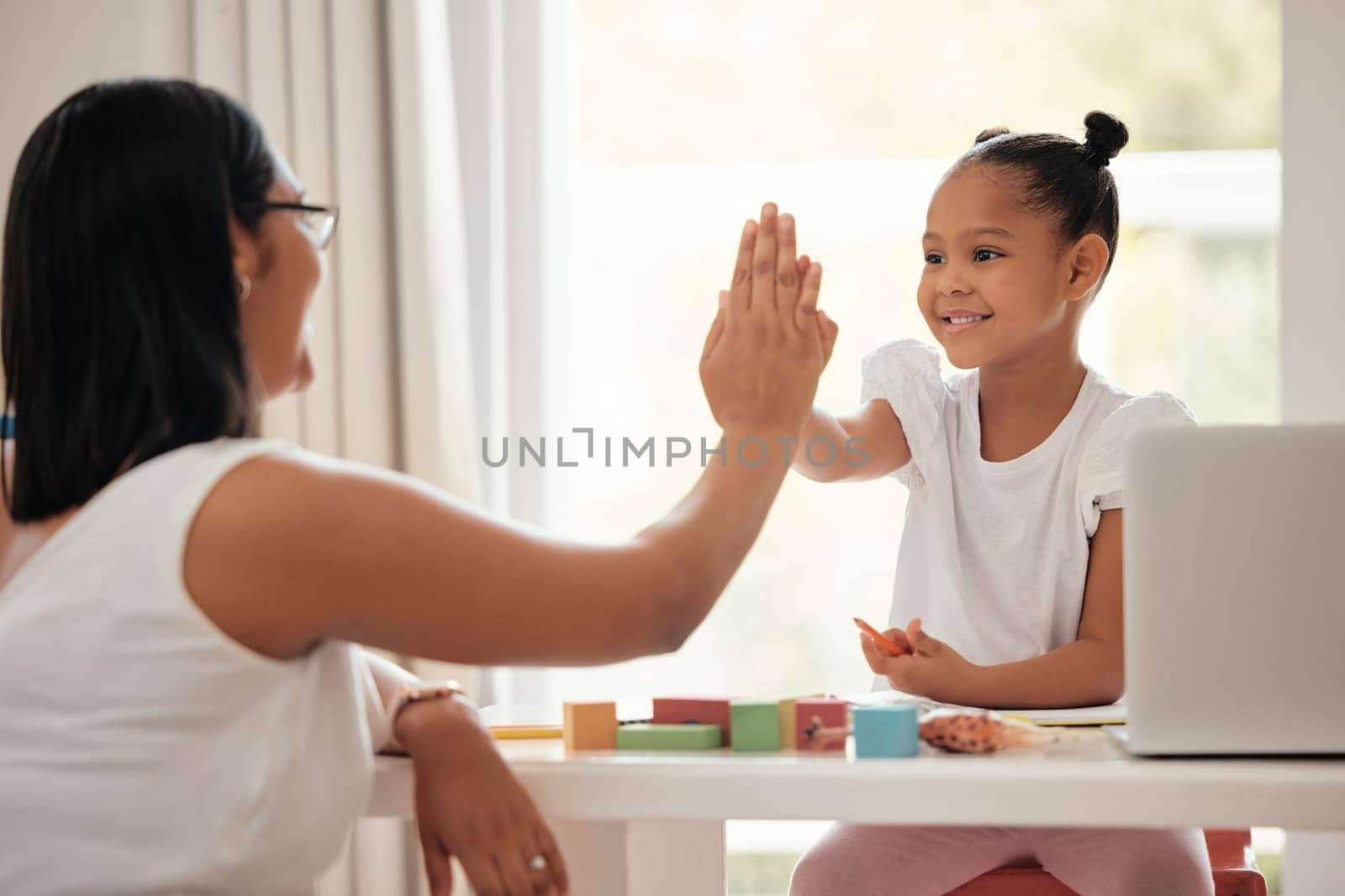 Education high five, family motivation and mother studying with girl for success, happy with learning progress and partnership with school work. Girl with support and help with homework from mom.