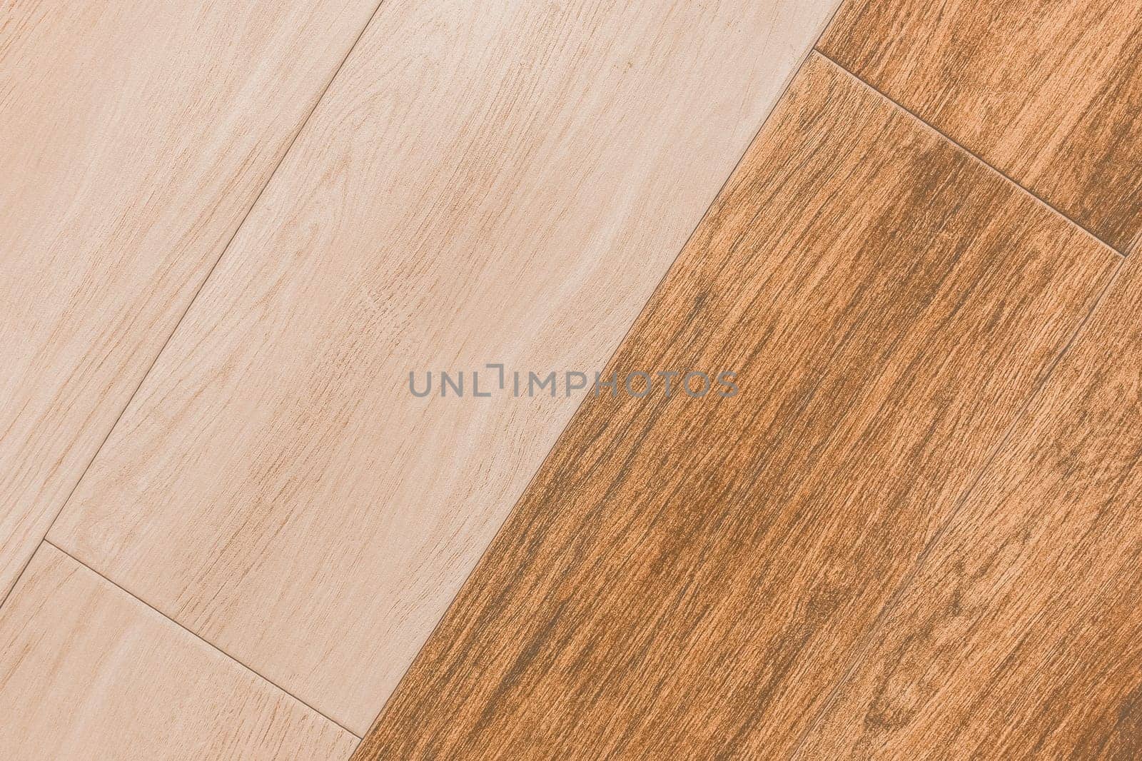 Wooden two color coating abstract pattern light and orange brown board background floor texture laminate flooring plank timber.