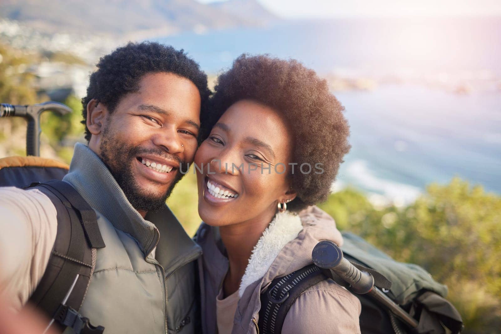 Nature, romance and selfie, couple hiking on mountain for fitness, fun and romantic walk in natural landscape in Hawaii. Love, man and woman talking self portrait with smile in mountains on island