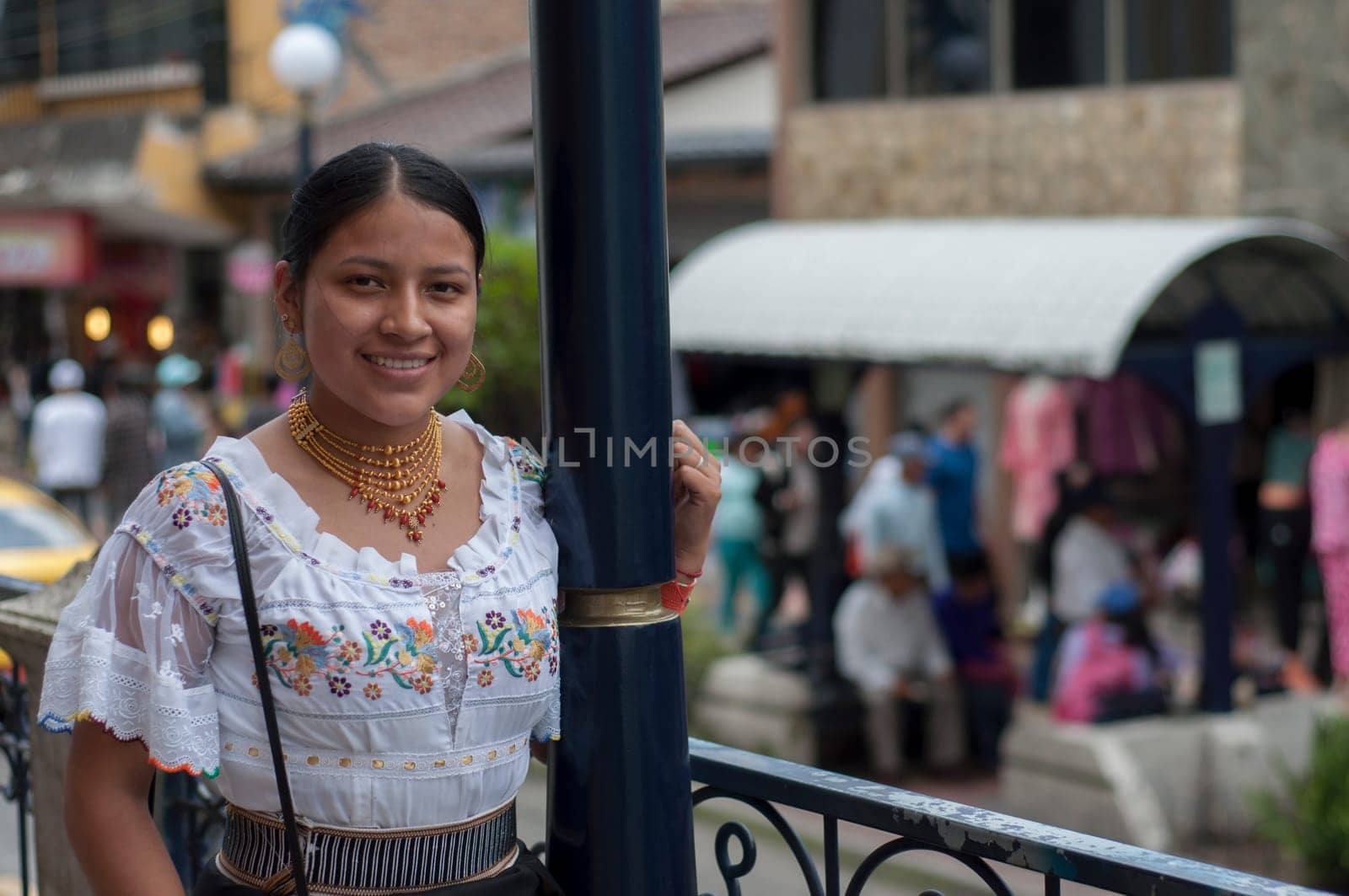 copy space of a tourist woman walking through the city with traditional indigenous dress. High quality photo