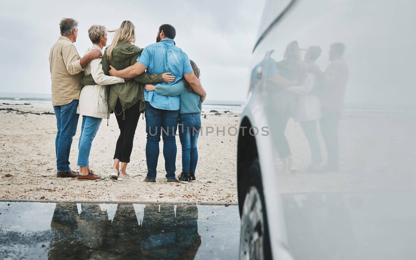 Travel, love and big family hug at ocean for bonding experience on road trip in Australia. Adventure, beach and drive for holiday break sightseeing with parents, grandparents and child