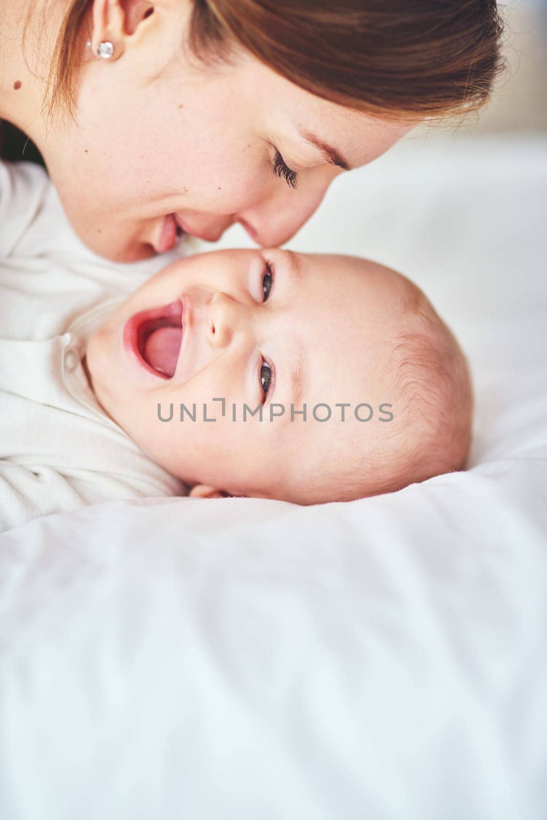 Shot of a young mother bonding with her adorable baby boy at home.