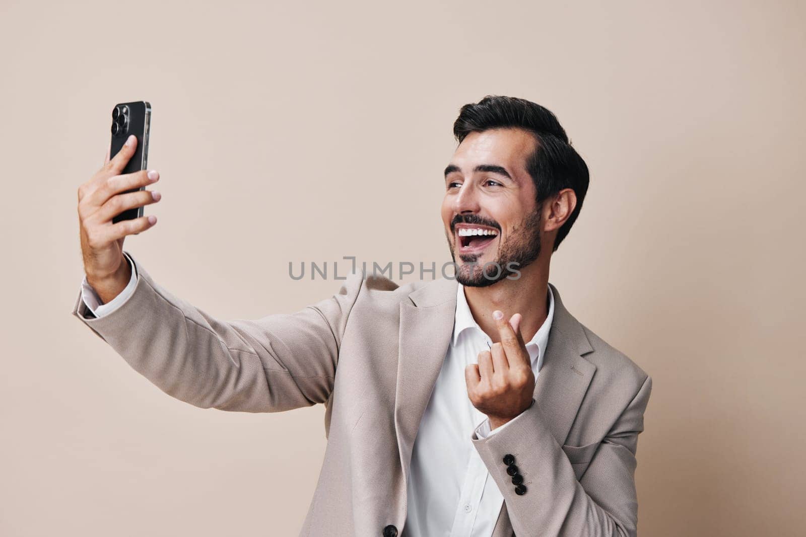 man beige phone trading hold business cell businessman smile smartphone suit connection happy selfies call gray background person portrait online isolated