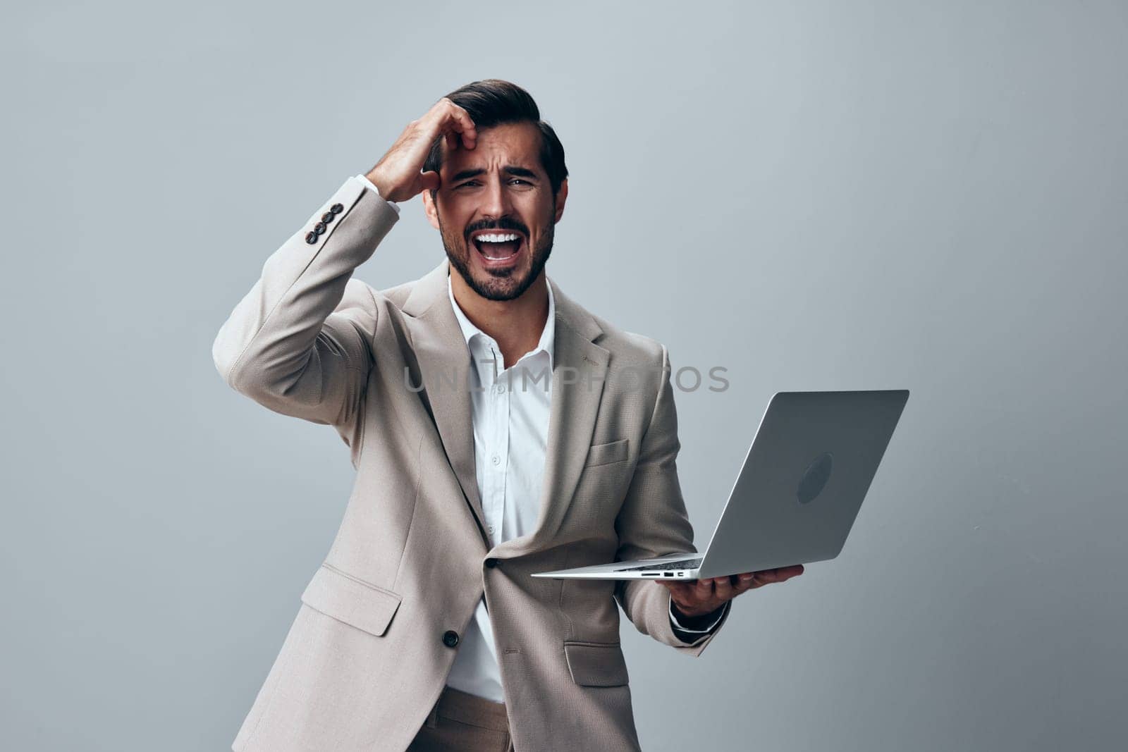 copyspace man digital isolated corporate freelancer smiling laptop computer wireless business cheerful background cyberspace adult beige job suit work manager internet