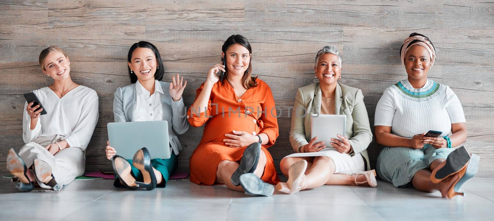 Creative business people, portrait smile and networking sitting together on floor at office. Happy group of employee women smiling with technology in team hiring, welcome or management for startup by YuriArcurs