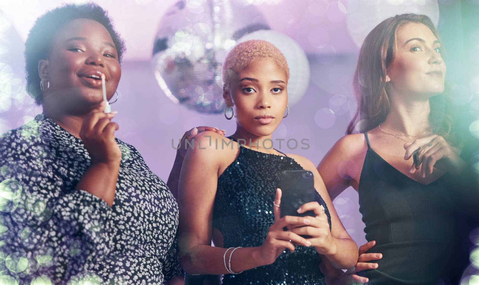 Women friends, nightclub and makeup portrait with phone, excited face and glitter aesthetic by light. Culture celebration, disco and gen z woman with diversity, freedom and cosmetic beauty at event.