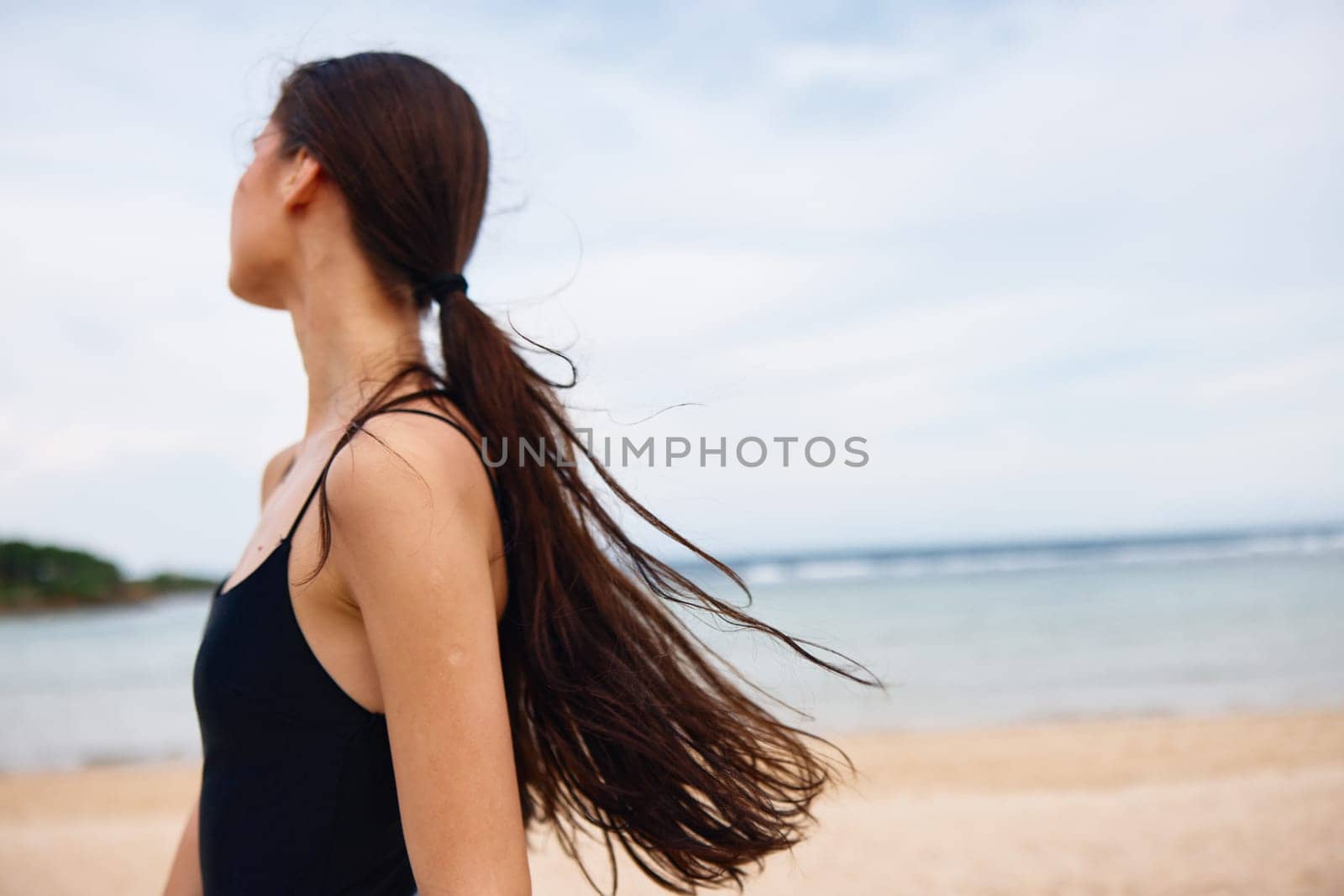 body woman nature summer lifestyle long travel sea active beach hair sunset leisure young flight freedom space sand smile happy running happiness copy