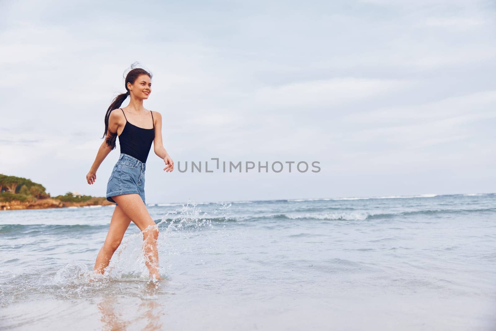 beach woman sun travel sea young summer smile lifestyle sunset running by SHOTPRIME