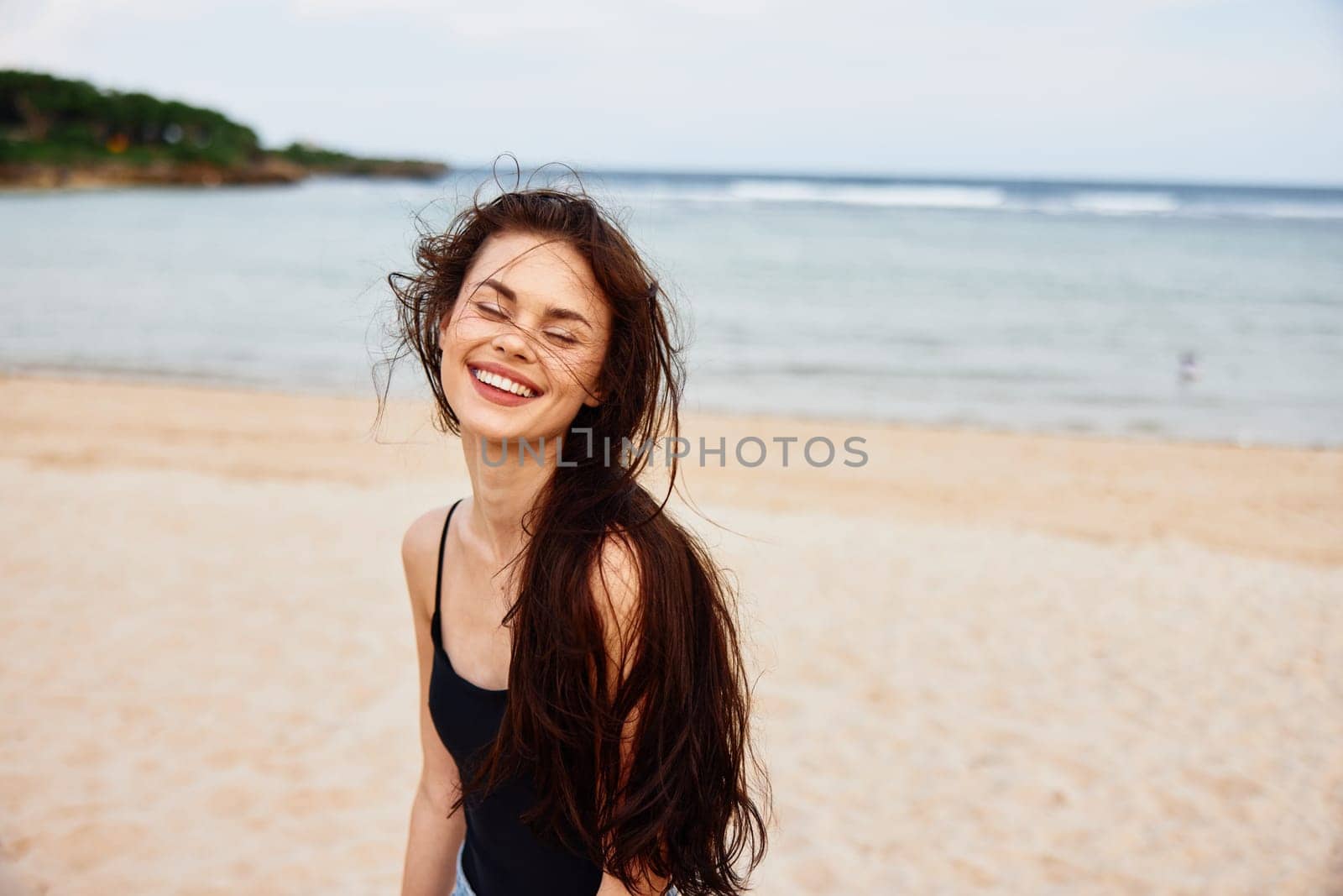 beauty woman dress sea female nature summer outdoor beach sand ocean copy smiling enjoyment young hair space tropical long vacation caucasian running smile