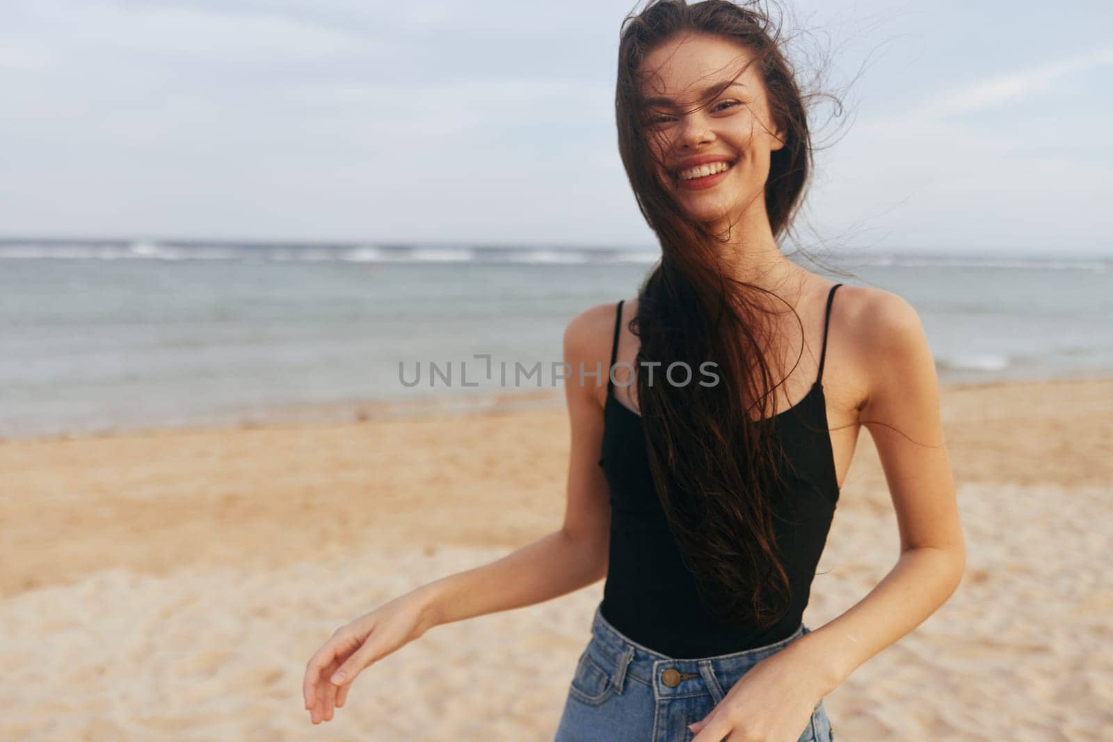 sunset woman ocean holiday beach vacation sand happiness tropical carefree caucasian summer outdoor sea walk smiling relax girl smile freedom lifestyle