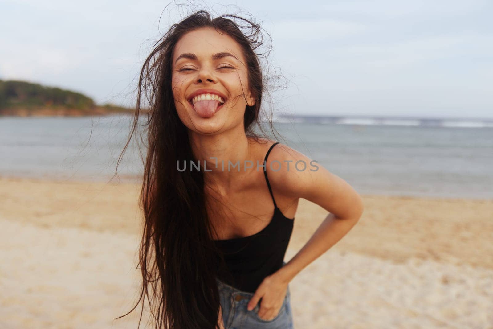 woman beach sand carefree enjoyment person smile happiness summer lifestyle shore leisure walking sea sunset young female vacation adult beautiful ocean