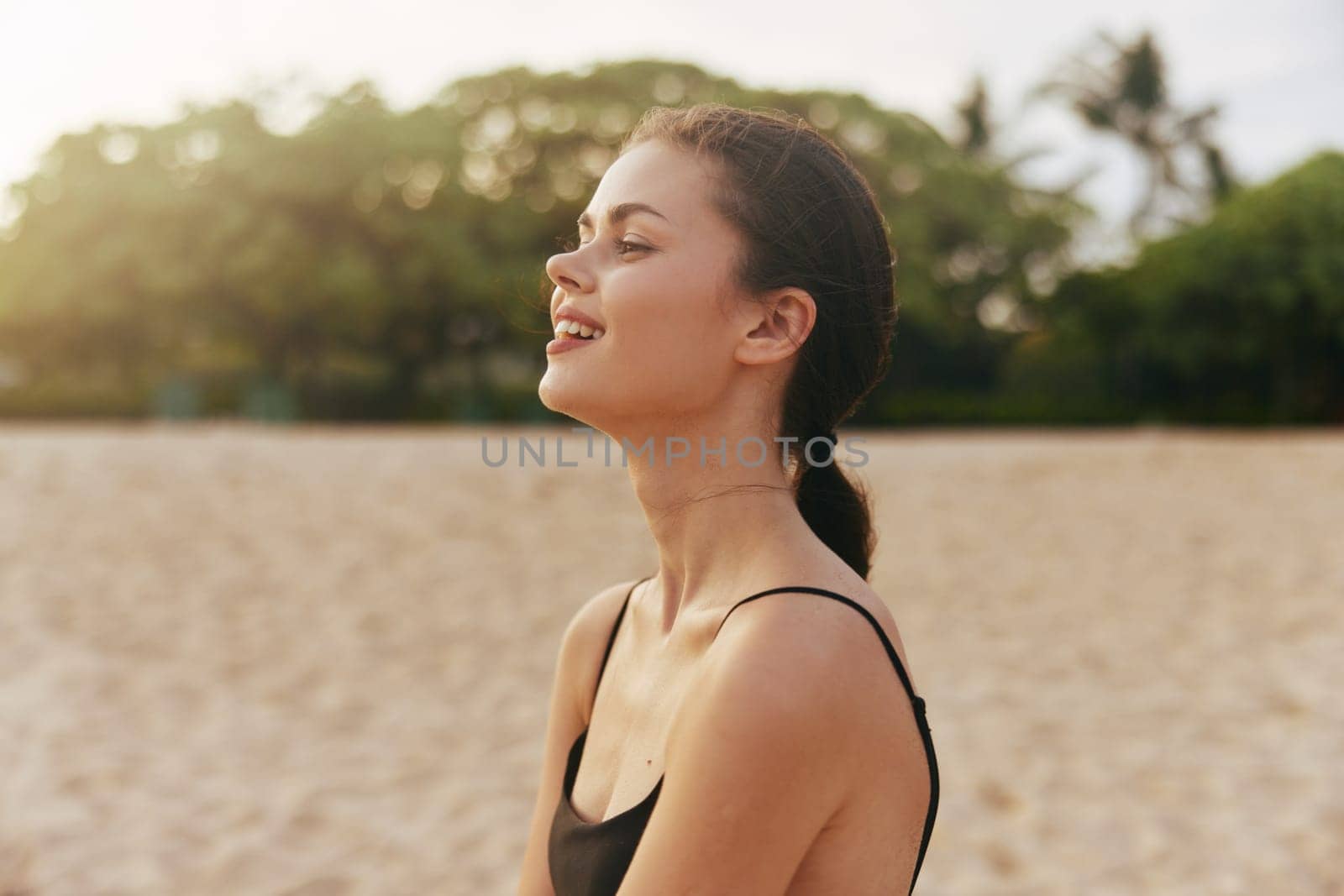 woman sun summer enjoyment free space lifestyle beach long happy sunset sand female hair copy dress caucasian young sea ocean vacation smile travel