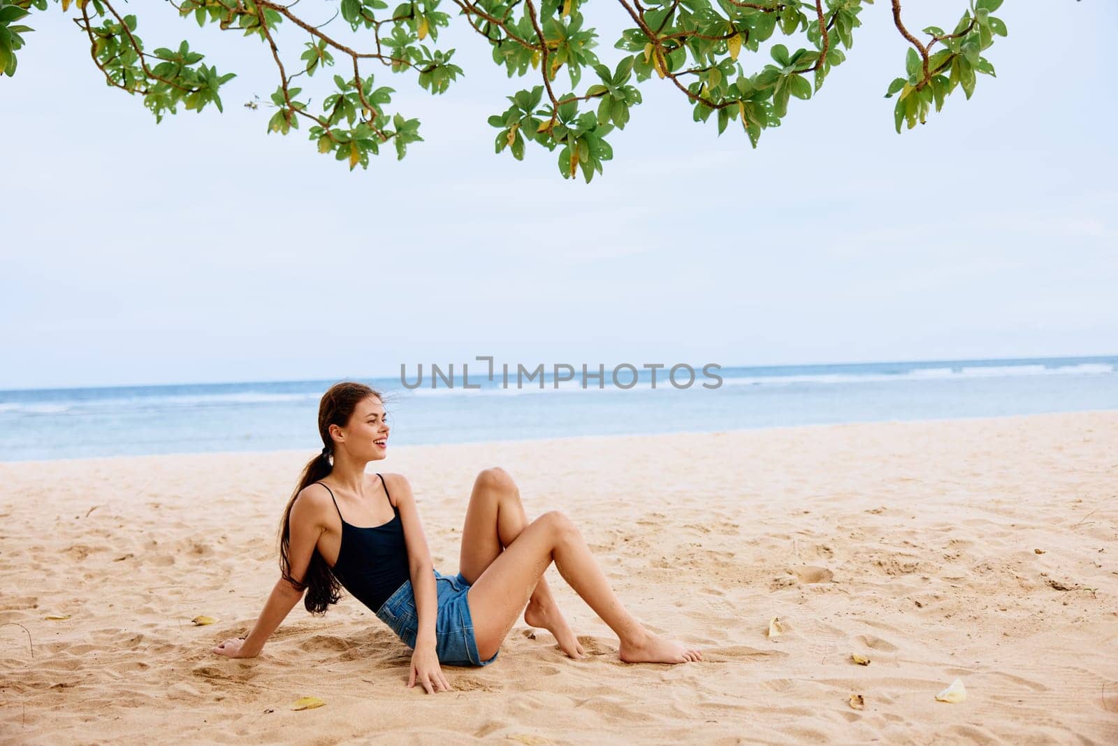 woman sea hair travel beach nature sitting freedom vacation sand smile by SHOTPRIME