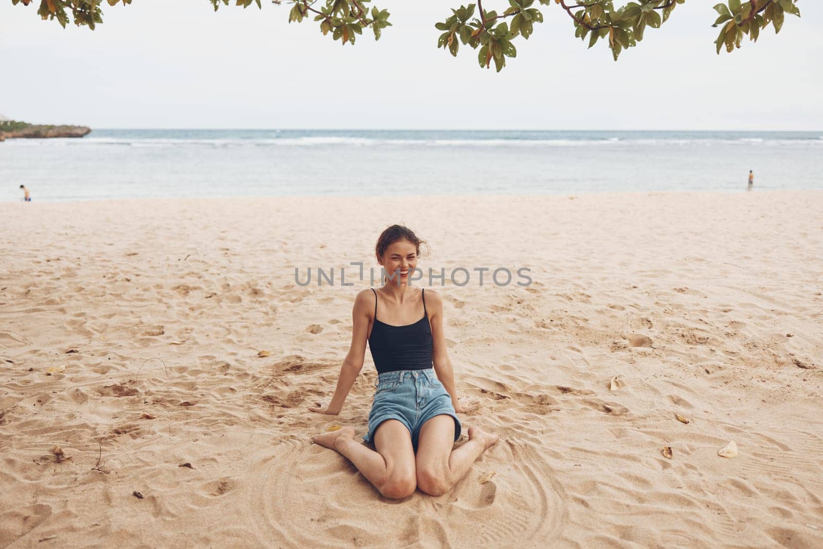 woman tan water model smile lifestyle view travel sea beach back freedom sitting outdoor vacation sand beautiful bali coast sexy nature pretty