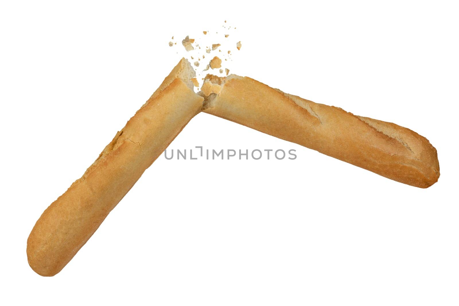 Loaf of long white bread isolated on white background. A loaf of crispy French baguette broken in half, crumbs flying in different directions. To be inserted into a design or project