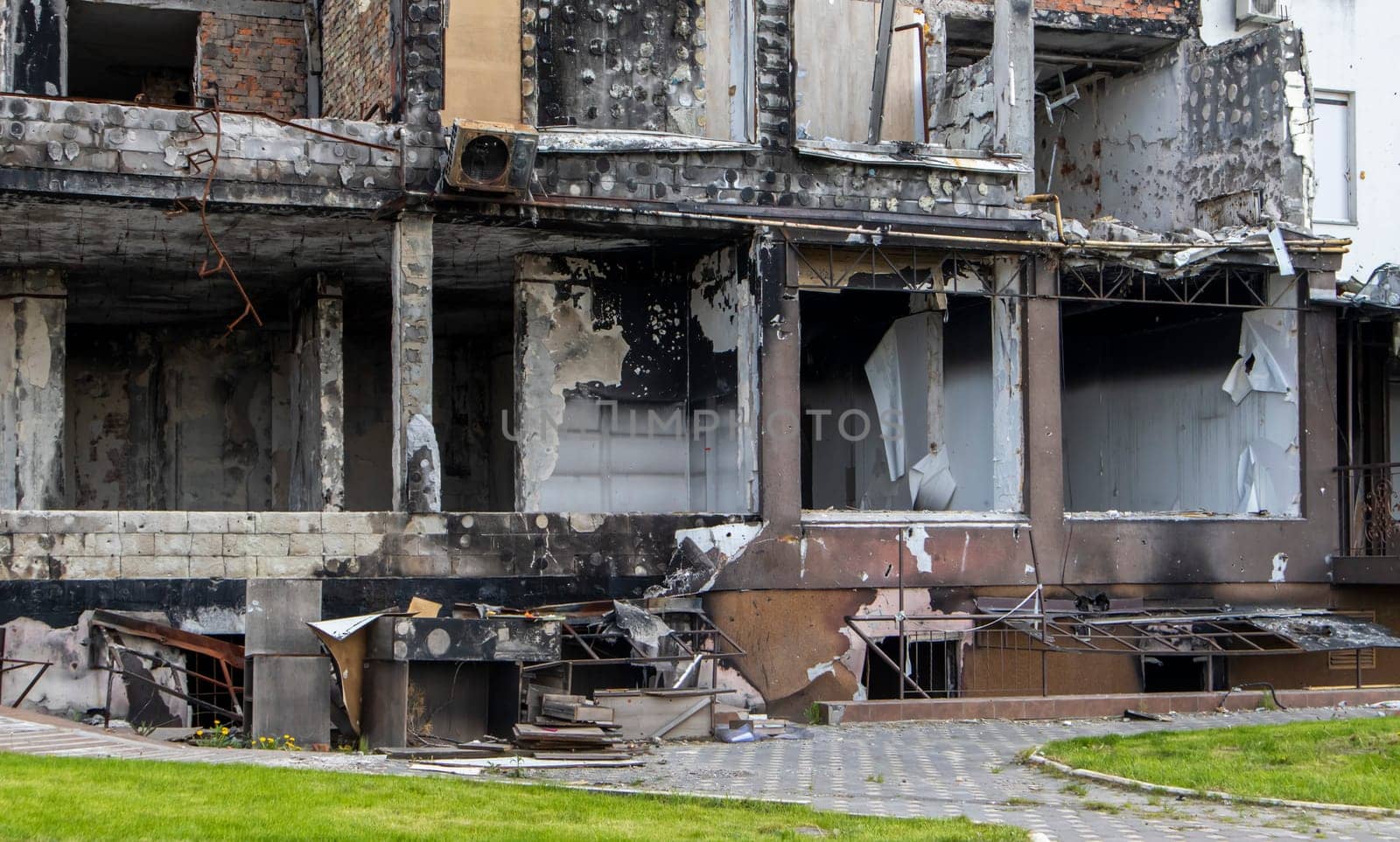 Residential buildings, windows and balconies were damaged by the blast and shrapnel from artillery shelling. The destruction of the city by military operations, the consequences of the war