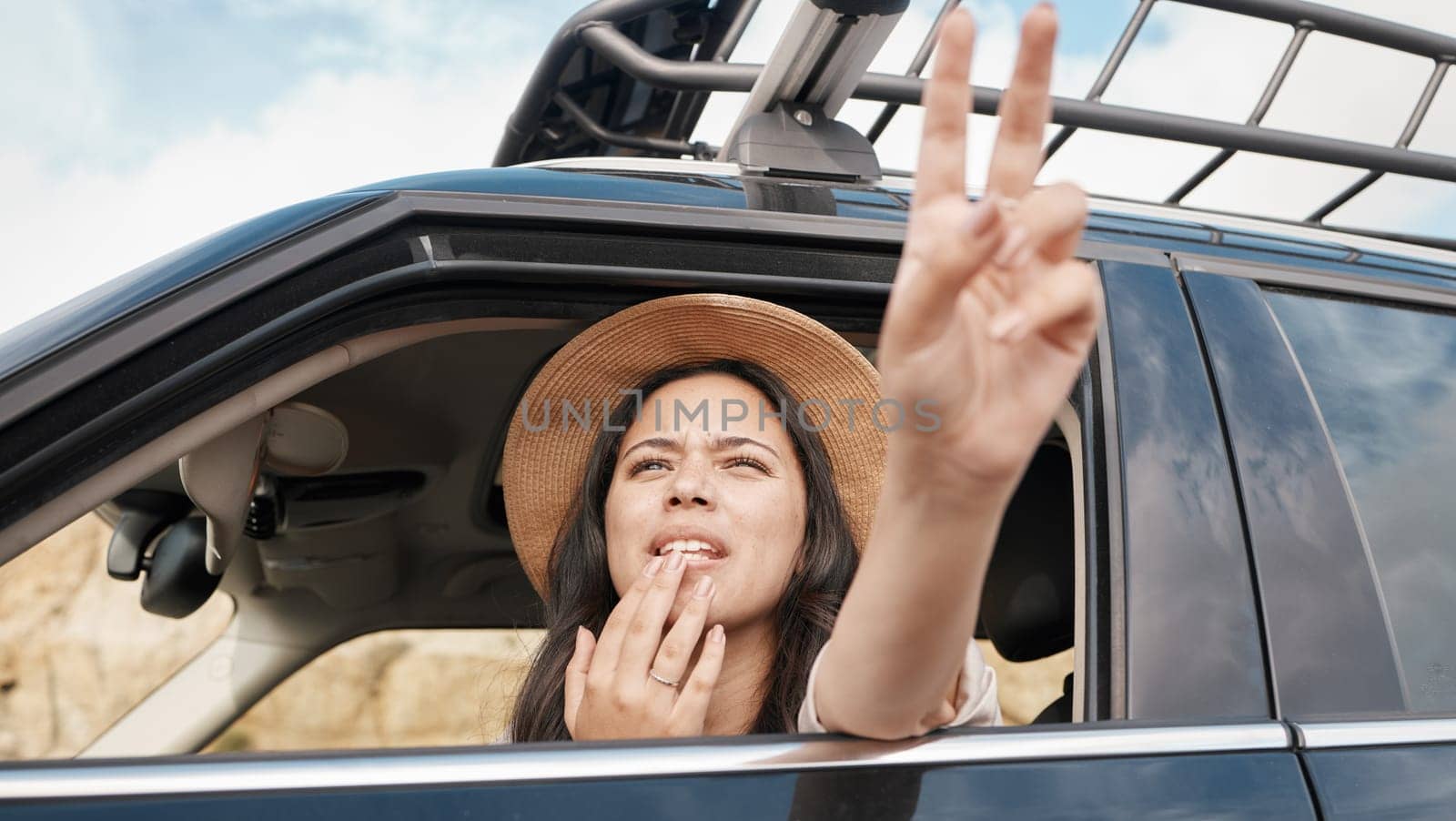 Travel, car and woman with peace hand sign, adventure and transportation for fun vacation and road trip with view. Young female, summer holiday and wait in automobile, journey and traveling. by YuriArcurs