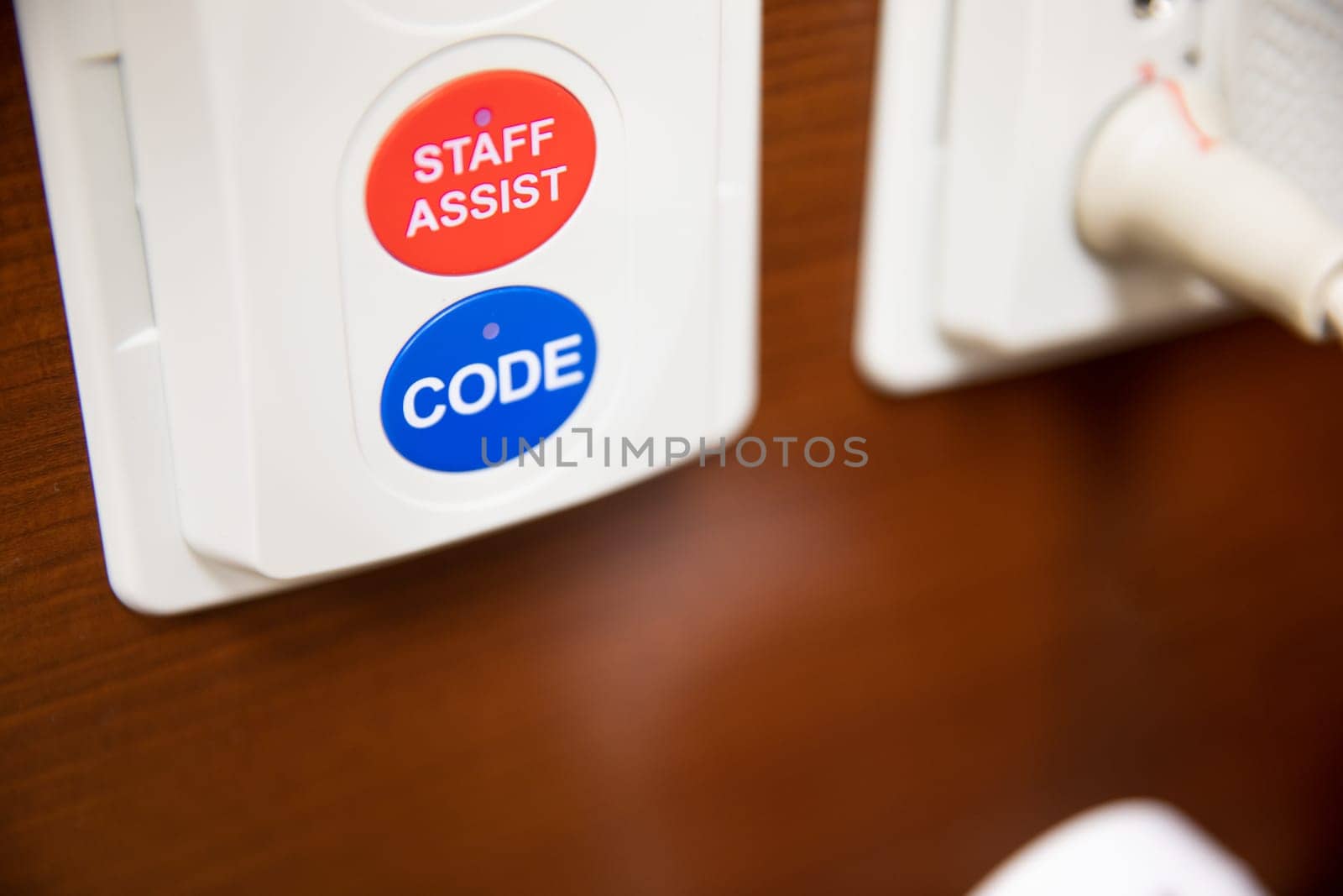 code button on the wall in an emergency room