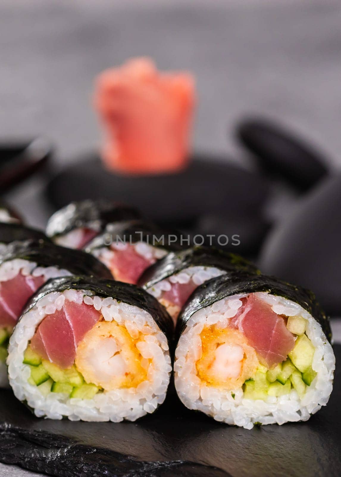 Sushi roll close up on dark background. Japanese and asian food concept by Satura86
