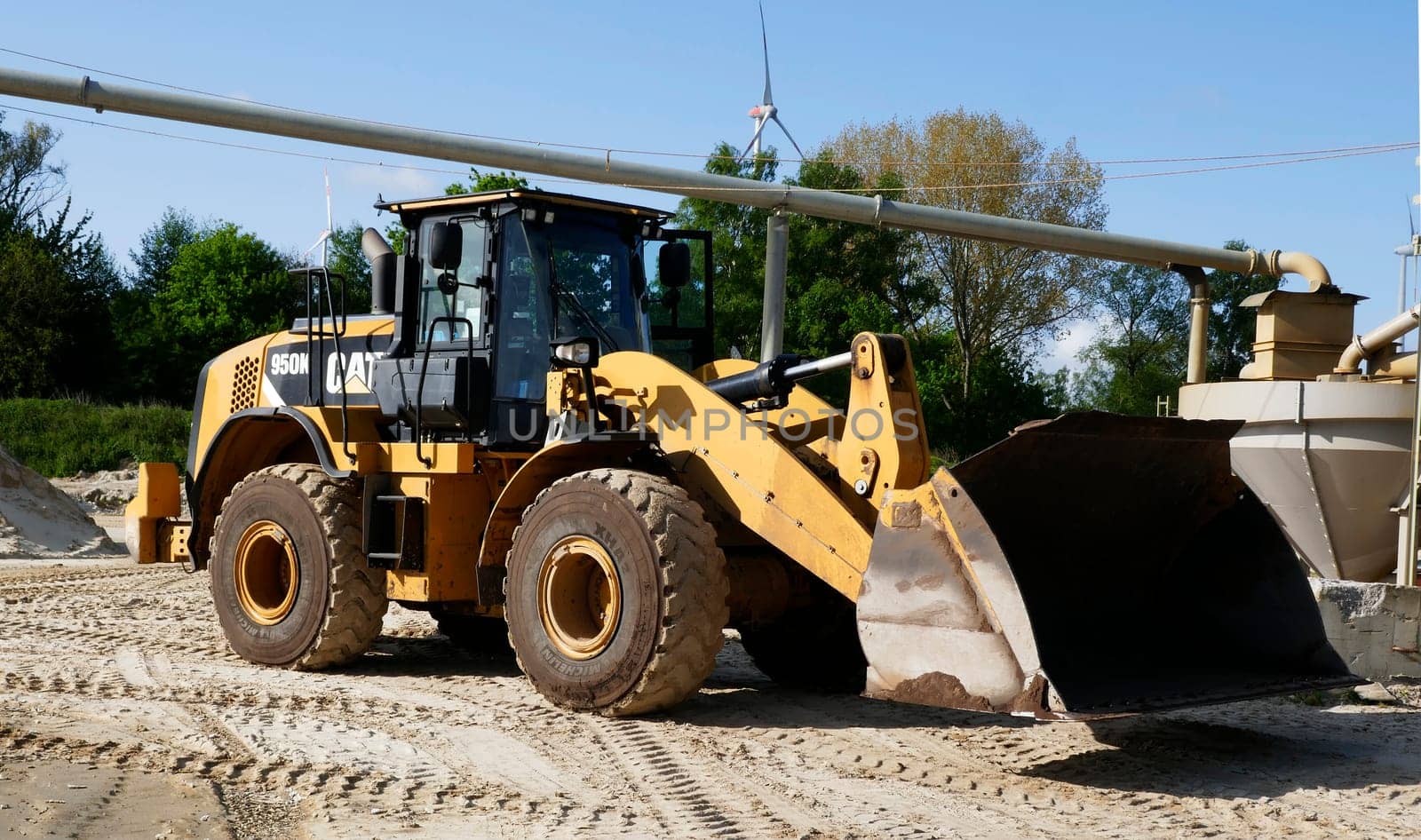 Hoogstede, Germany May 16 2023 A Caterpillar or CAT 950K wheel loader stands in the area of ​​a sand excavation